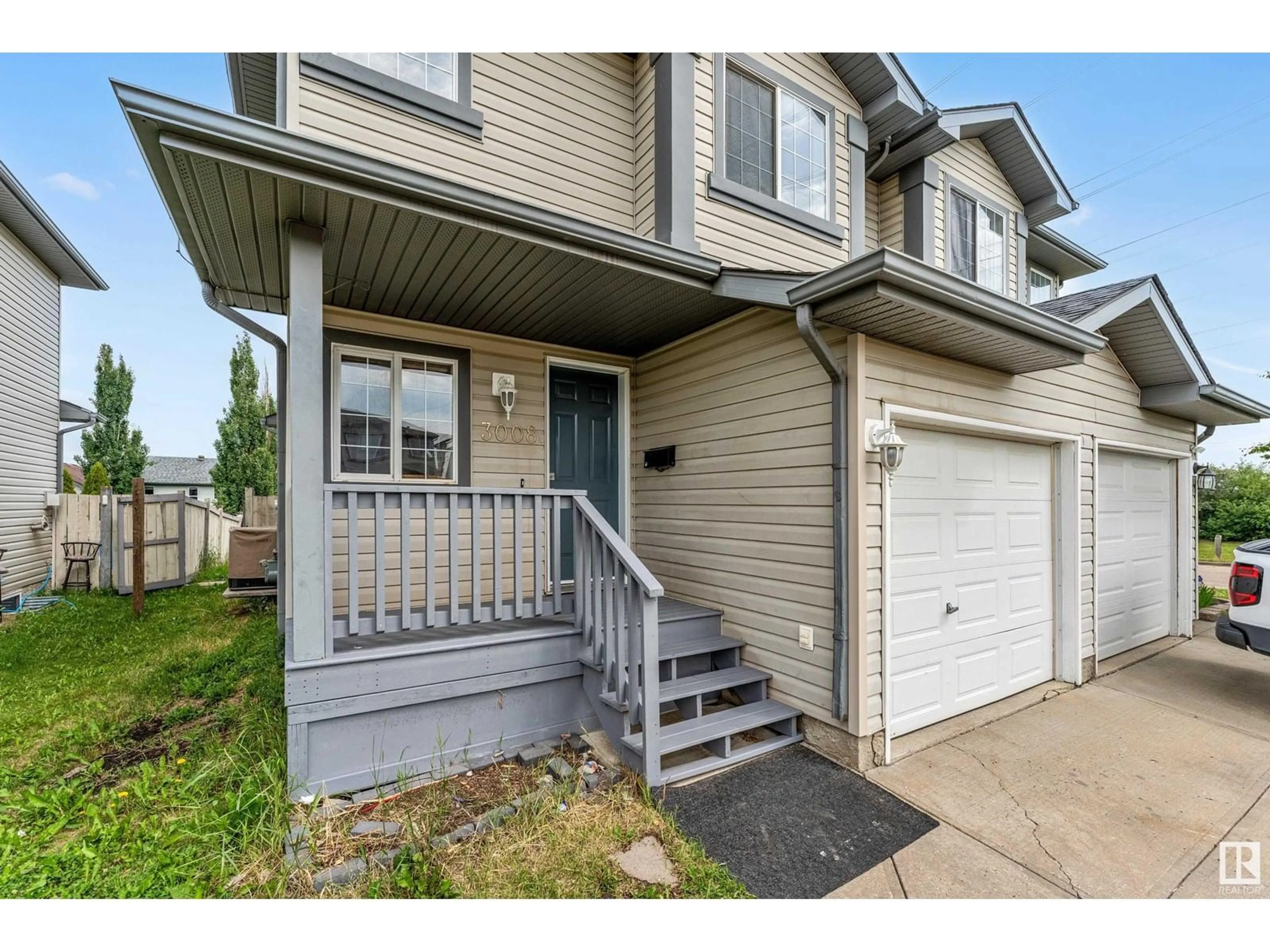 Home with vinyl exterior material, street for 3008 31 AVENUE, Edmonton Alberta T6T1W9
