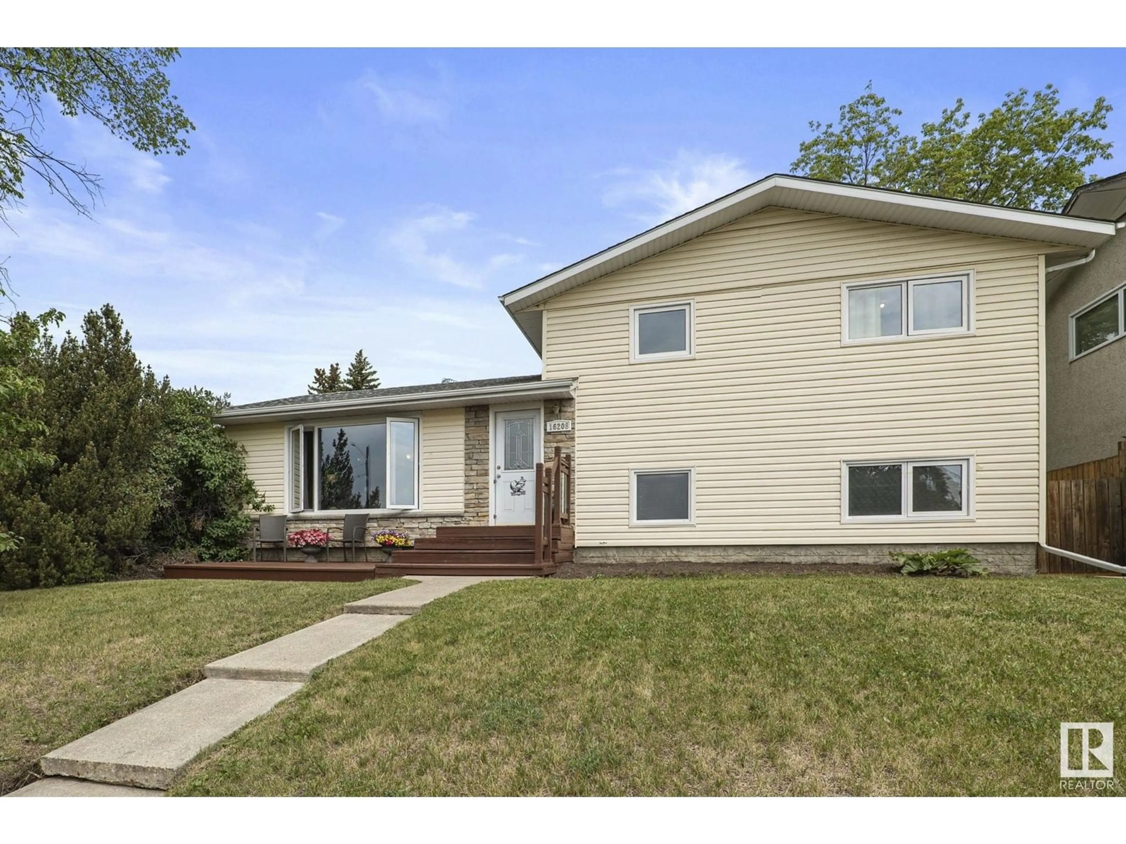 Home with vinyl exterior material, street for 16208 87 AV, Edmonton Alberta T5R4G9