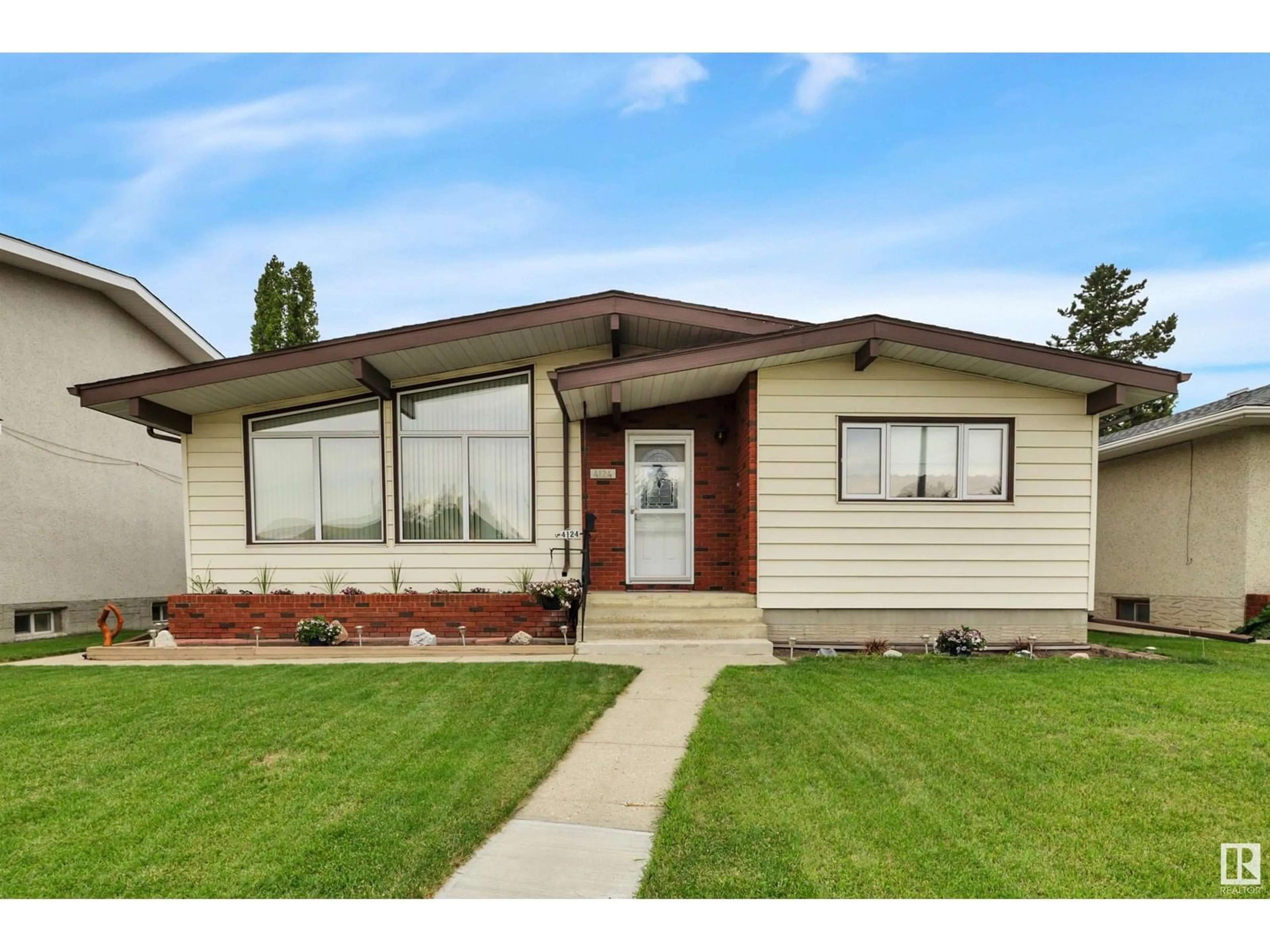 Home with vinyl exterior material, street for NW - 4124 112 ST, Edmonton Alberta T5J1J5