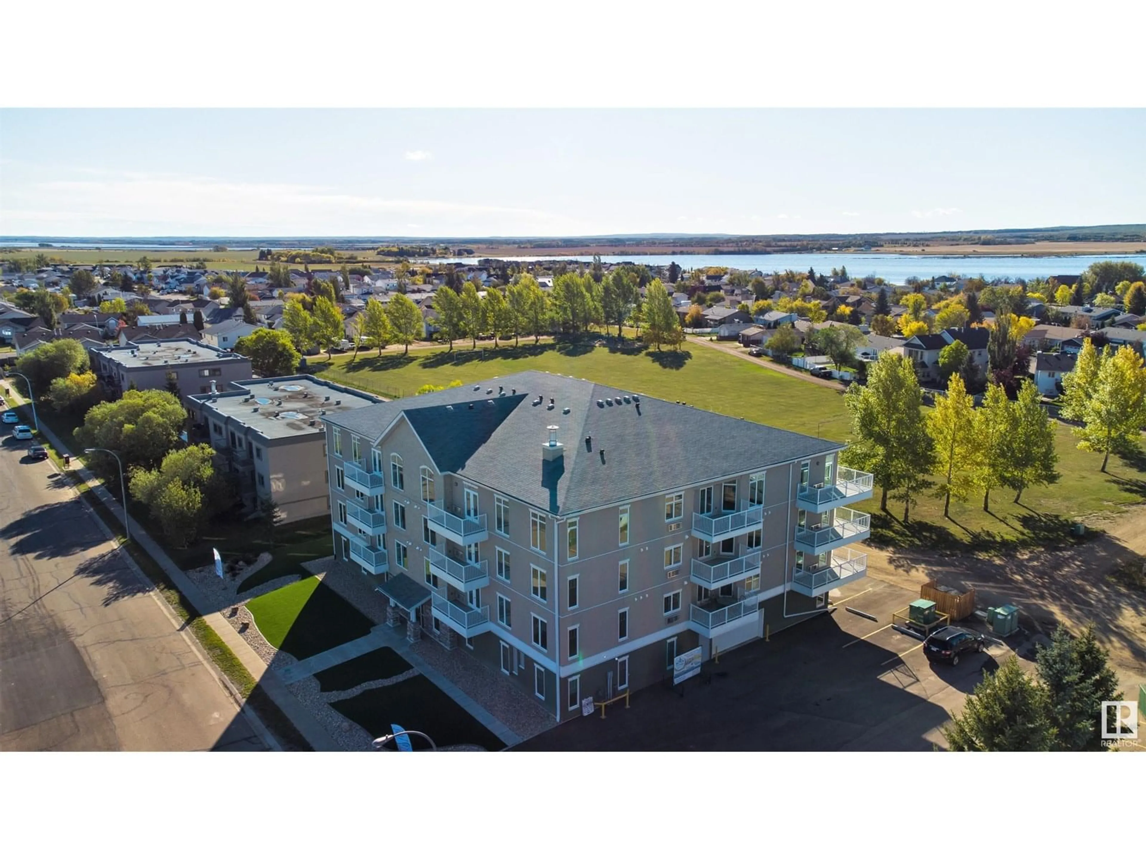 A pic from outside/outdoor area/front of a property/back of a property/a pic from drone, water/lake/river/ocean view for #102 - 4110 43 AV, Bonnyville Town Alberta T9N1S8
