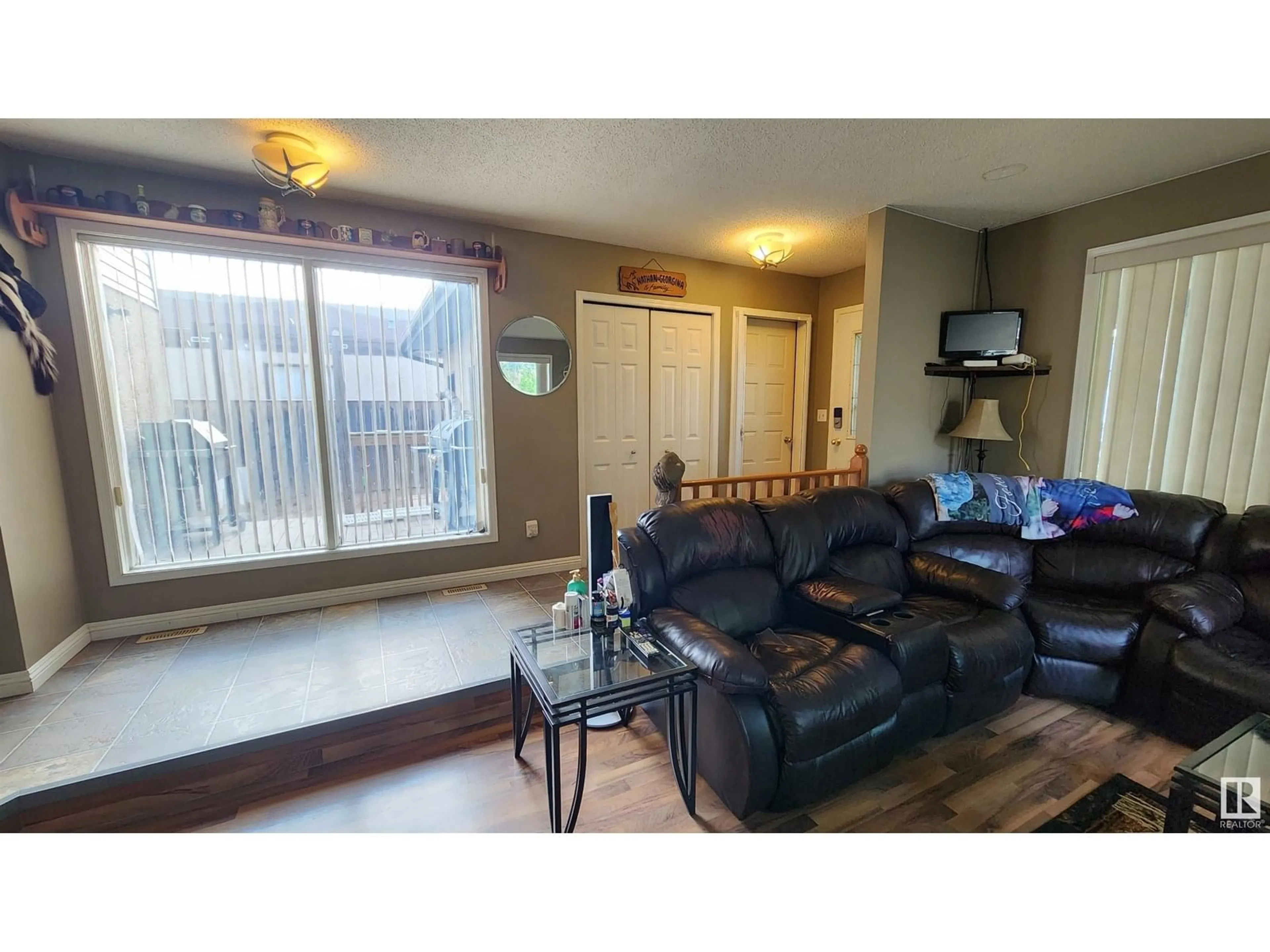 Living room with furniture, wood/laminate floor for 5101 58 AV, Elk Point Alberta T0A1A0