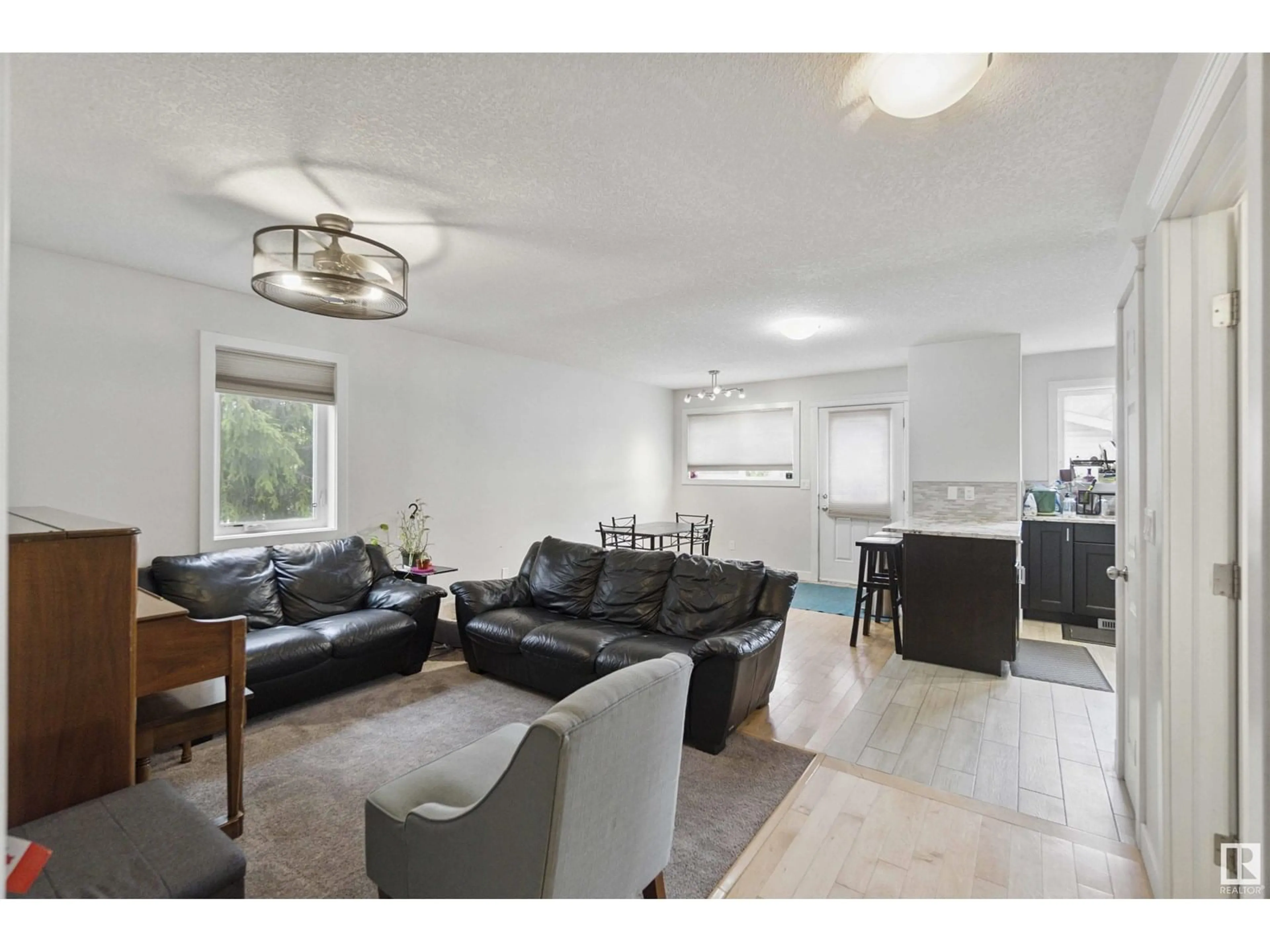 Living room with furniture, unknown for NW - 11438 97 ST, Edmonton Alberta T5X1X5