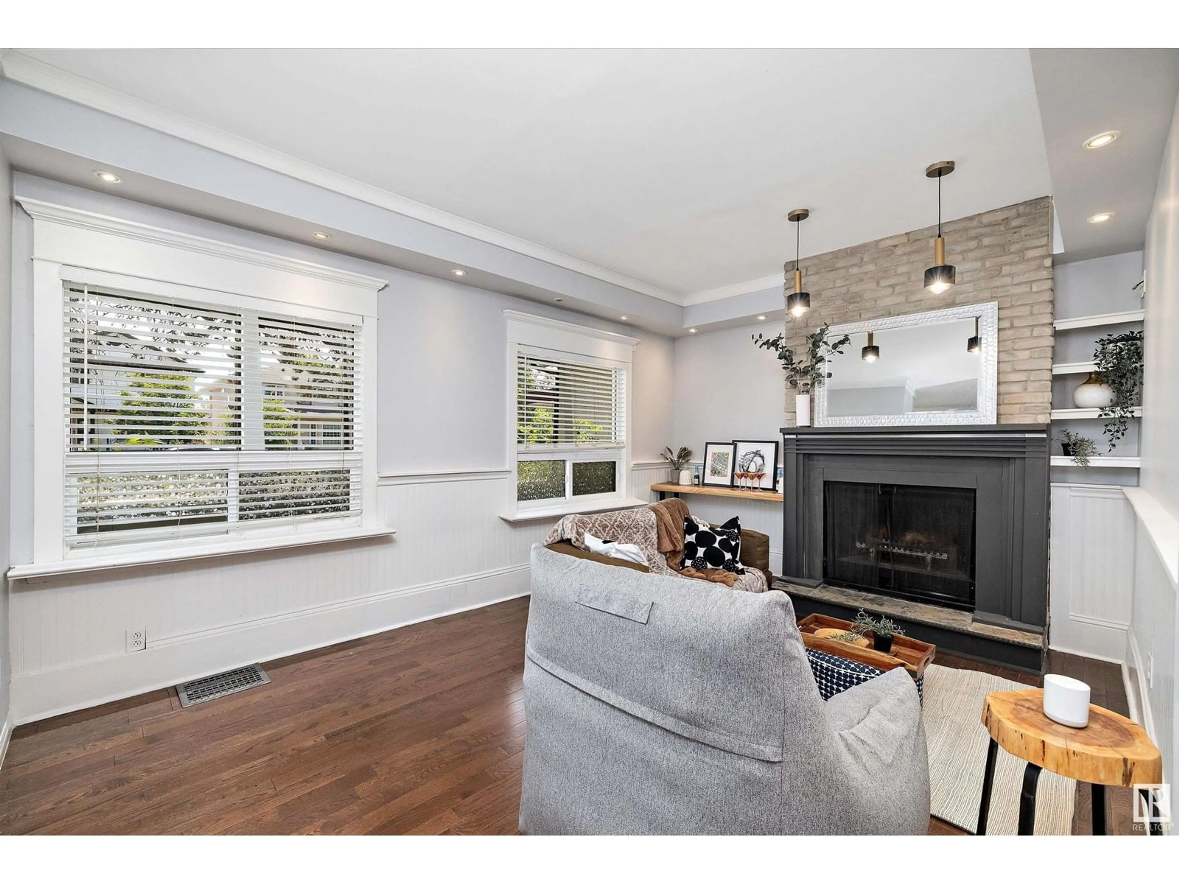 Living room with furniture, wood/laminate floor for 8702 92A AV, Edmonton Alberta T6C1S6