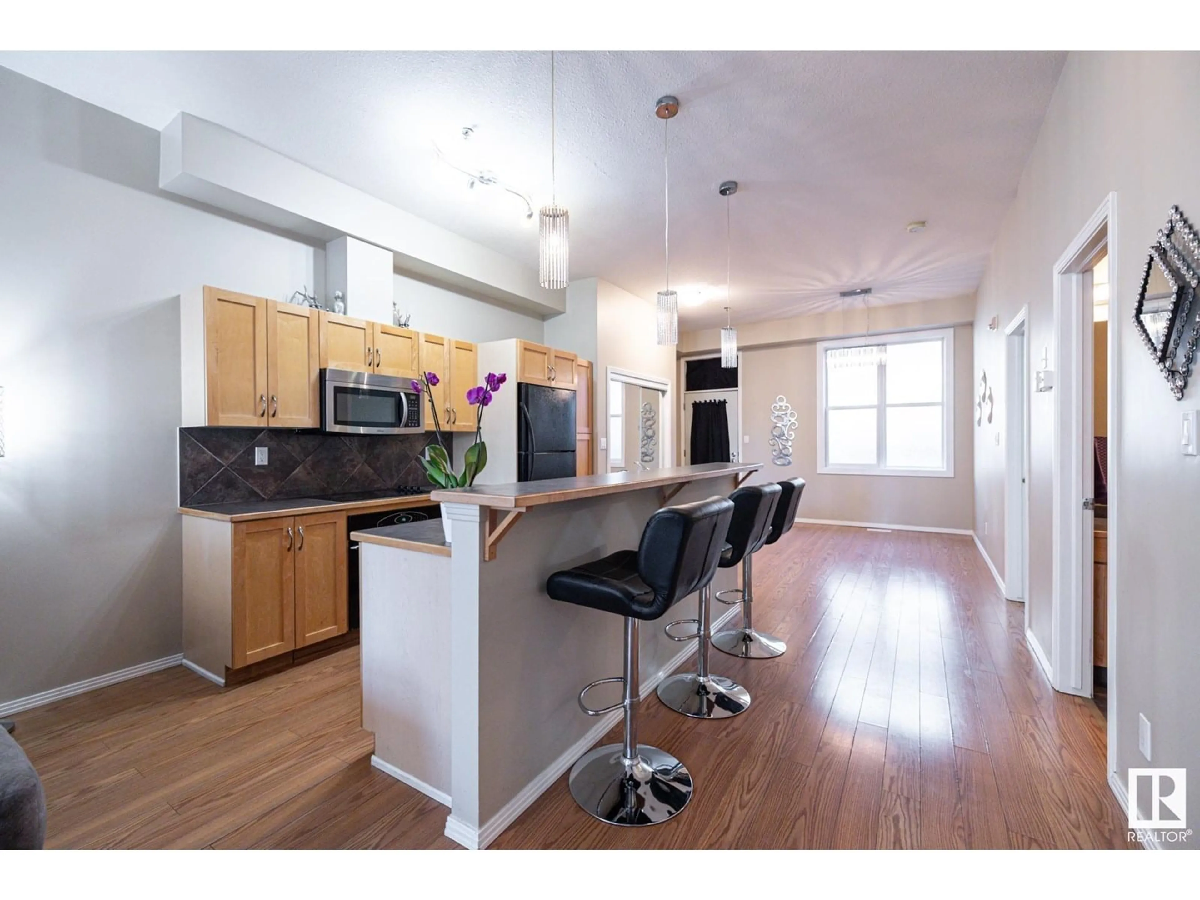 Open concept kitchen, wood/laminate floor for 10147 - 421 112 ST, Edmonton Alberta T5K1M1