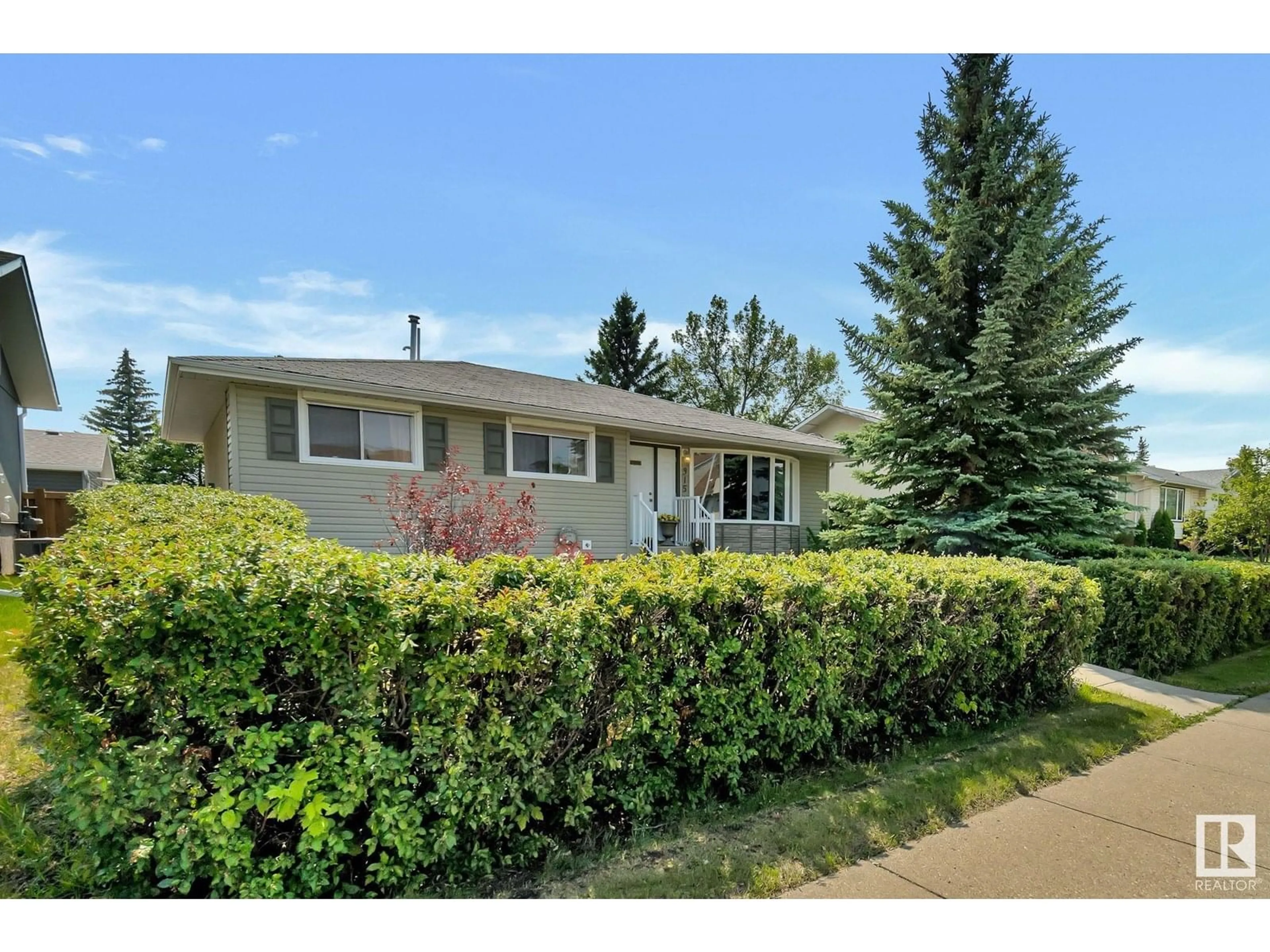Home with vinyl exterior material, street for 315 KNOTTWOOD ROAD NORTH NW, Edmonton Alberta T6K2G5