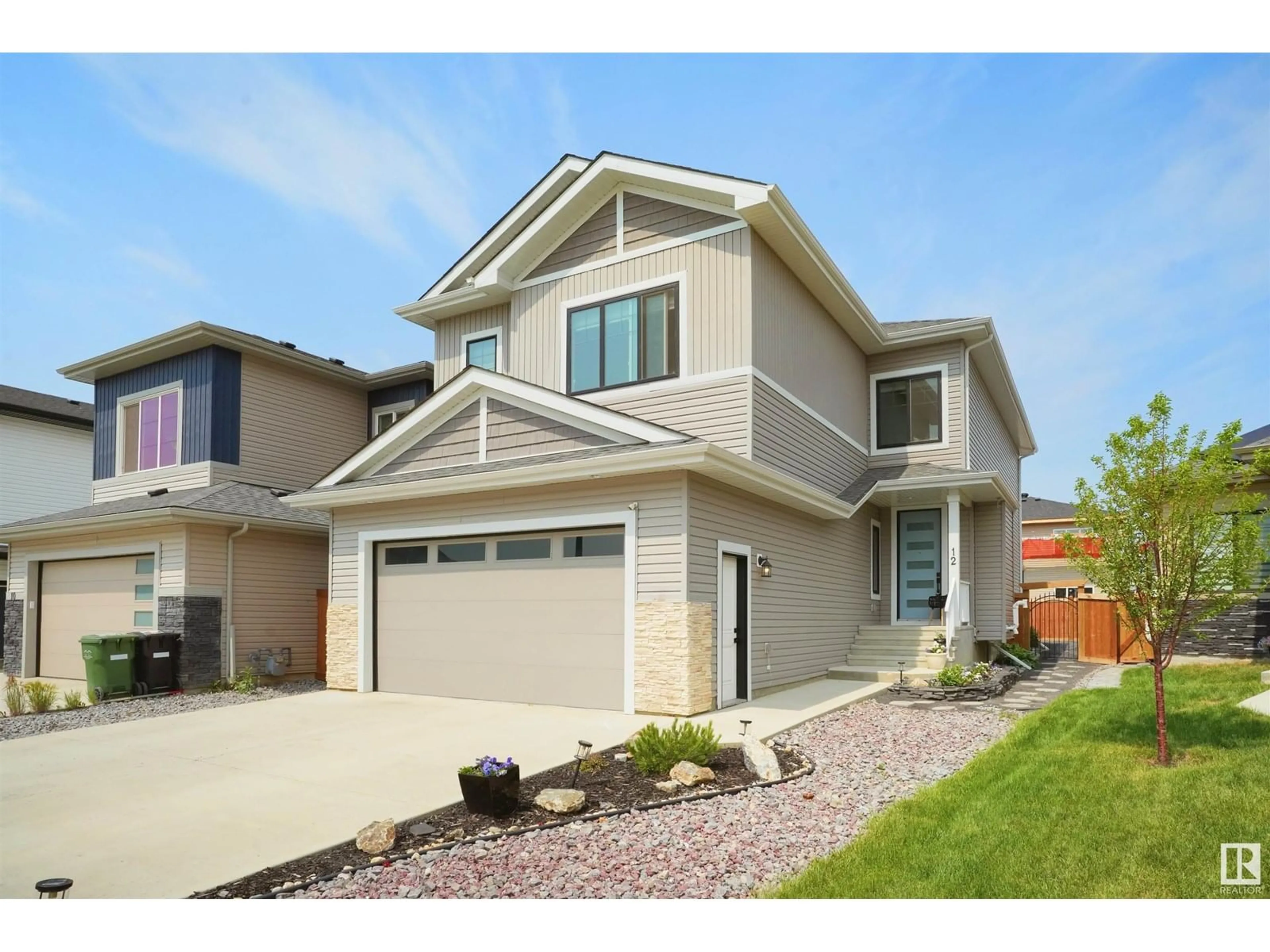 Home with vinyl exterior material, street for 12 CALEDONIA, Leduc Alberta T9E0S9