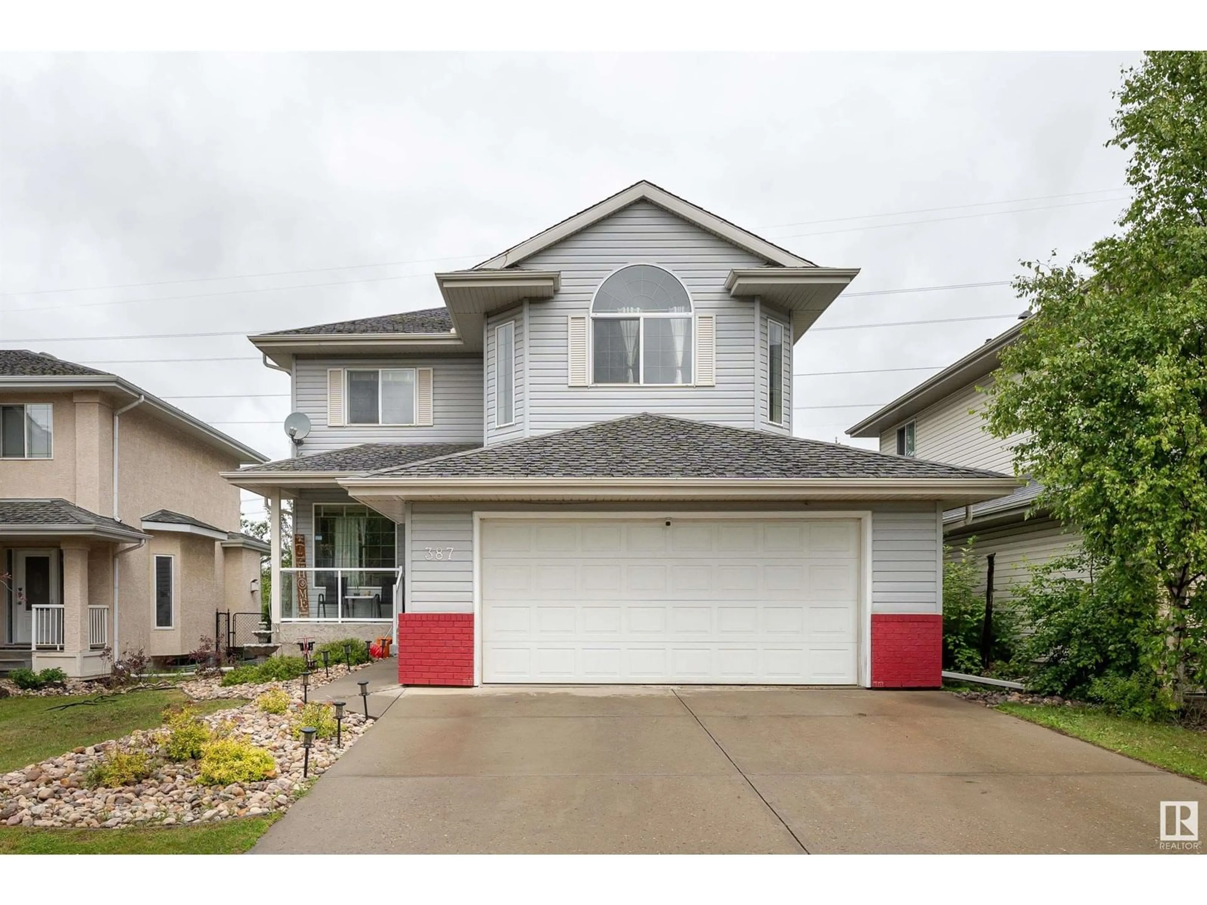 Home with vinyl exterior material, street for 387 HEATH RD, Edmonton Alberta T6R2T8