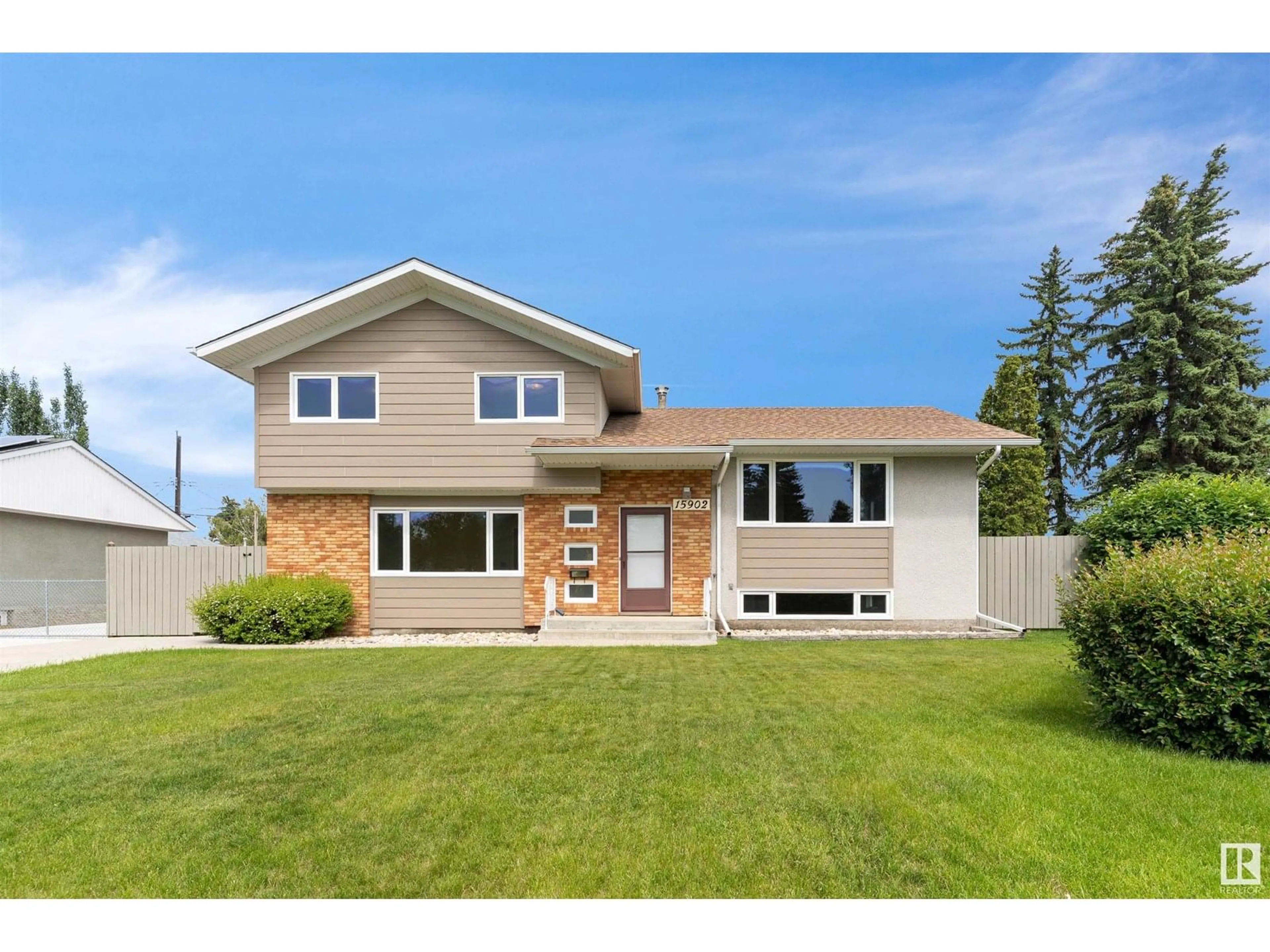Home with vinyl exterior material, street for 15902 94 AV, Edmonton Alberta T5R5K8