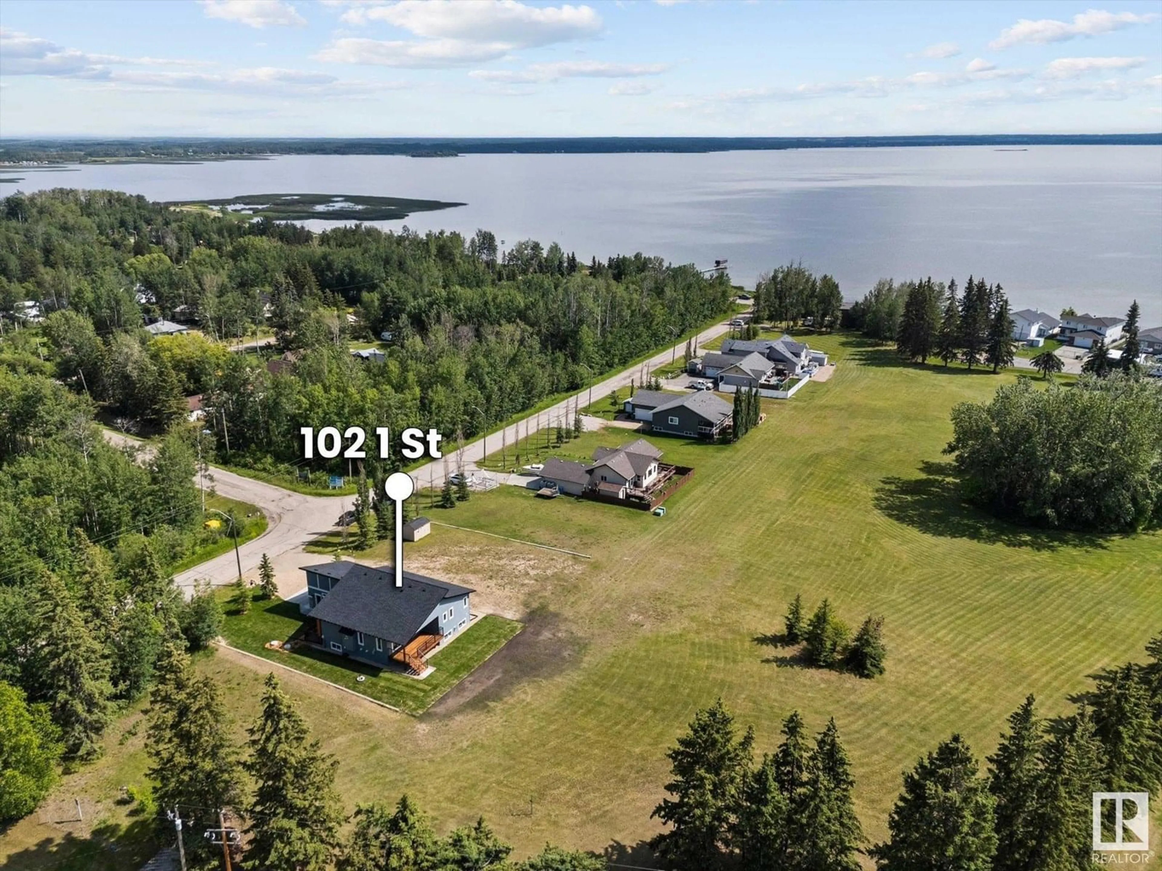 A pic from outside/outdoor area/front of a property/back of a property/a pic from drone, water/lake/river/ocean view for 102 1 STREET, Rural Lac Ste. Anne County Alberta T0E0A0