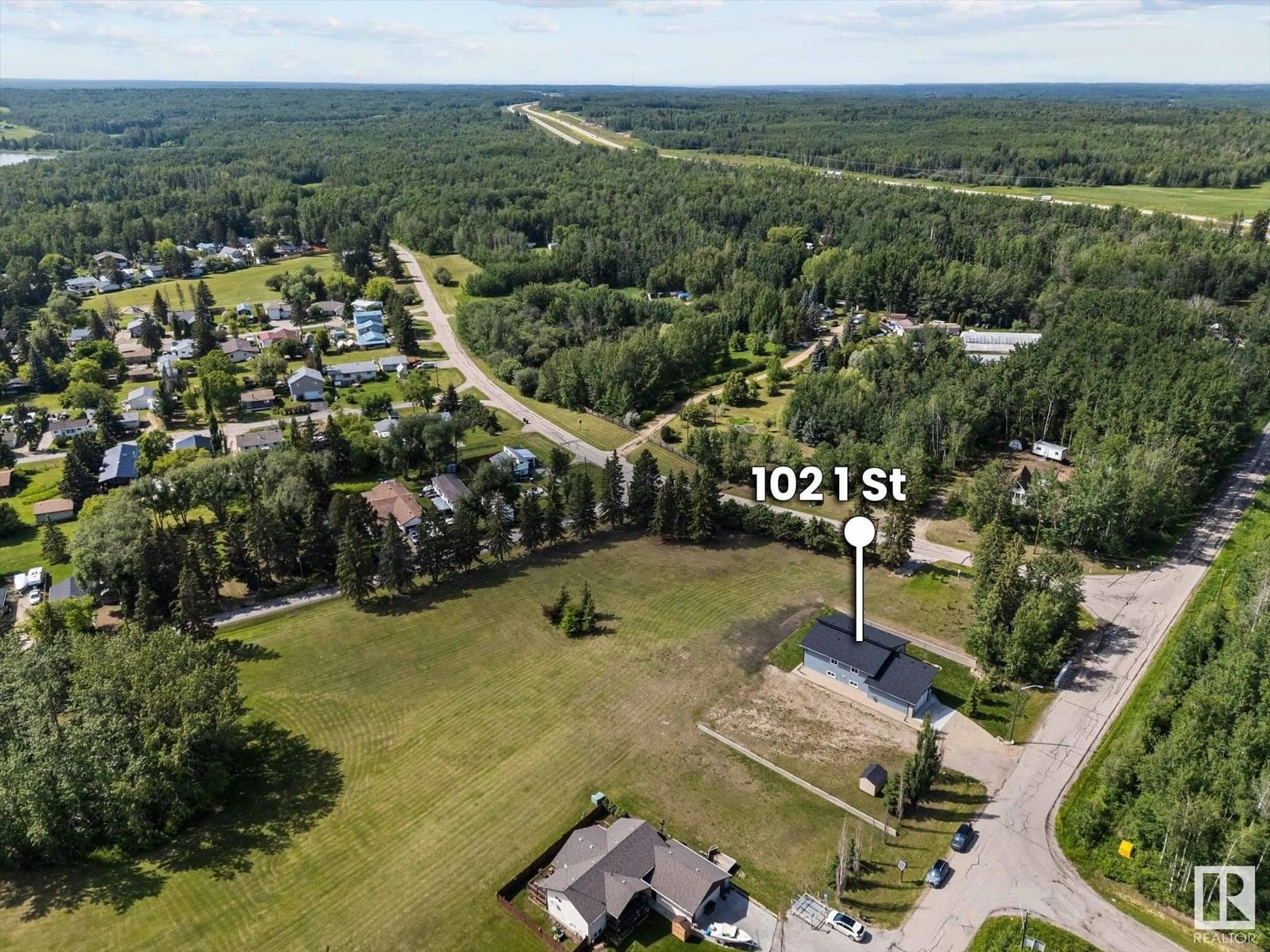 A pic from outside/outdoor area/front of a property/back of a property/a pic from drone, forest/trees view for 102 1 STREET, Rural Lac Ste. Anne County Alberta T0E0A0