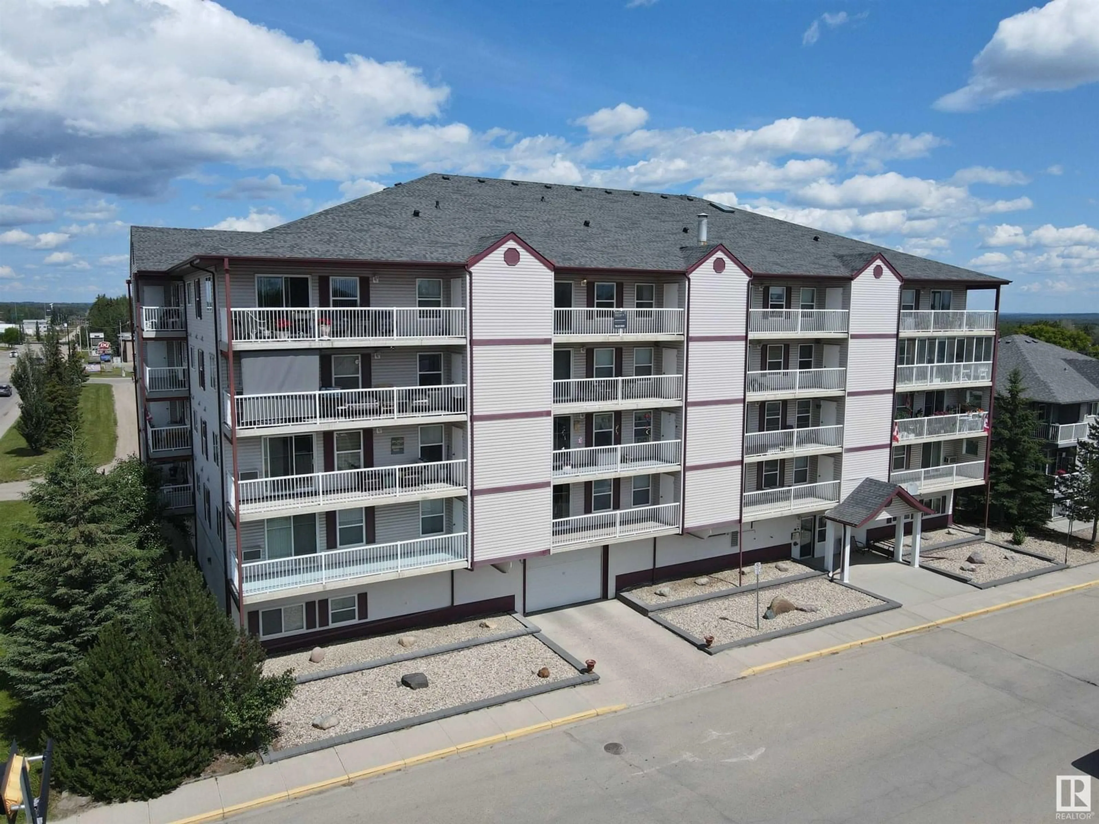A pic from outside/outdoor area/front of a property/back of a property/a pic from drone, building for #402 - 4900 54 AV, Drayton Valley Alberta T7A1V8