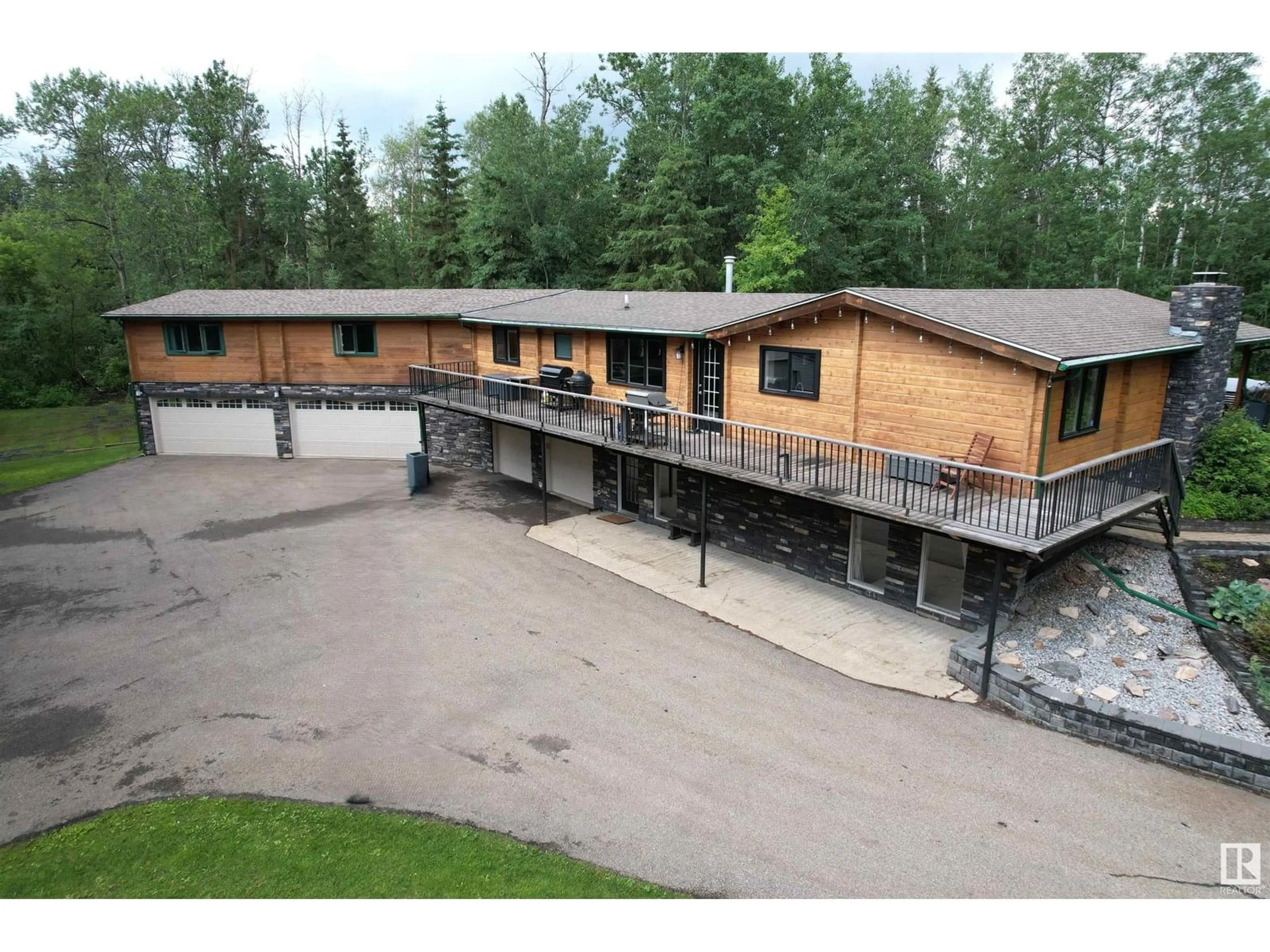 A pic from outside/outdoor area/front of a property/back of a property/a pic from drone, building for 218 - 52148 RGE ROAD 231, Rural Strathcona County Alberta T8B1A6