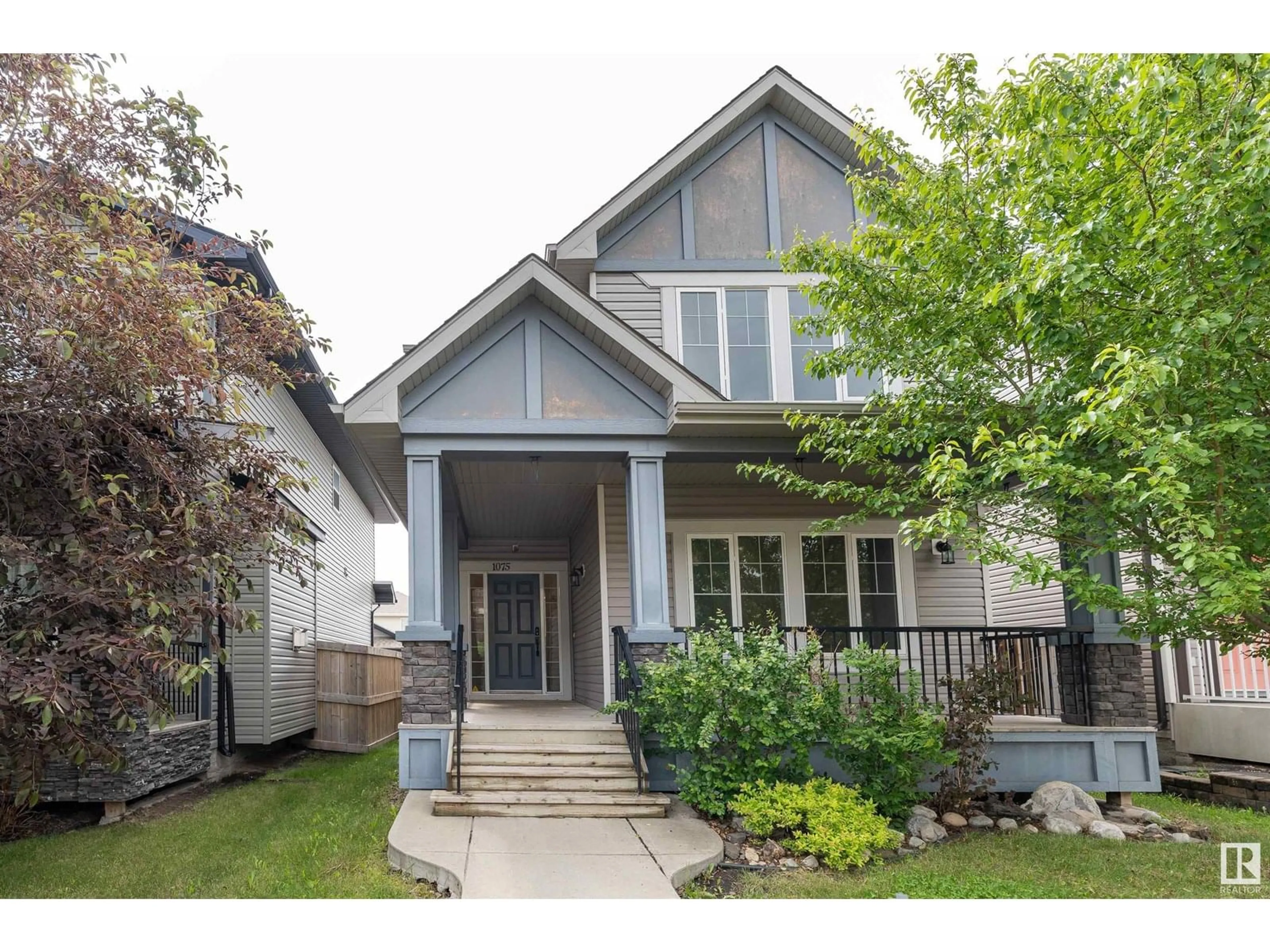 Home with vinyl exterior material, street for 1075 MCCONACHIE BV, Edmonton Alberta T5Y0P7