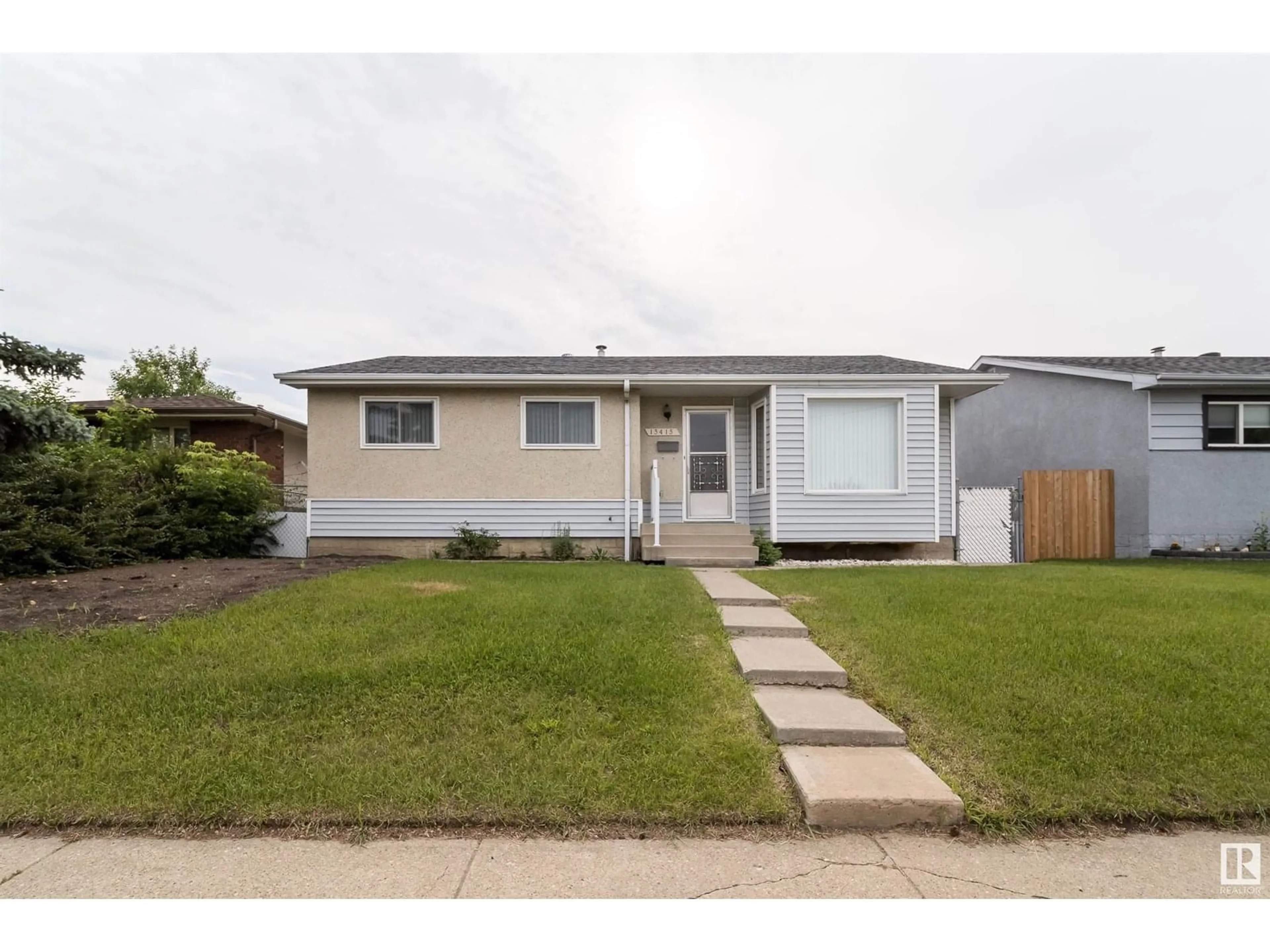 Home with vinyl exterior material, street for NW - 13415 67 ST, Edmonton Alberta T5C0C6