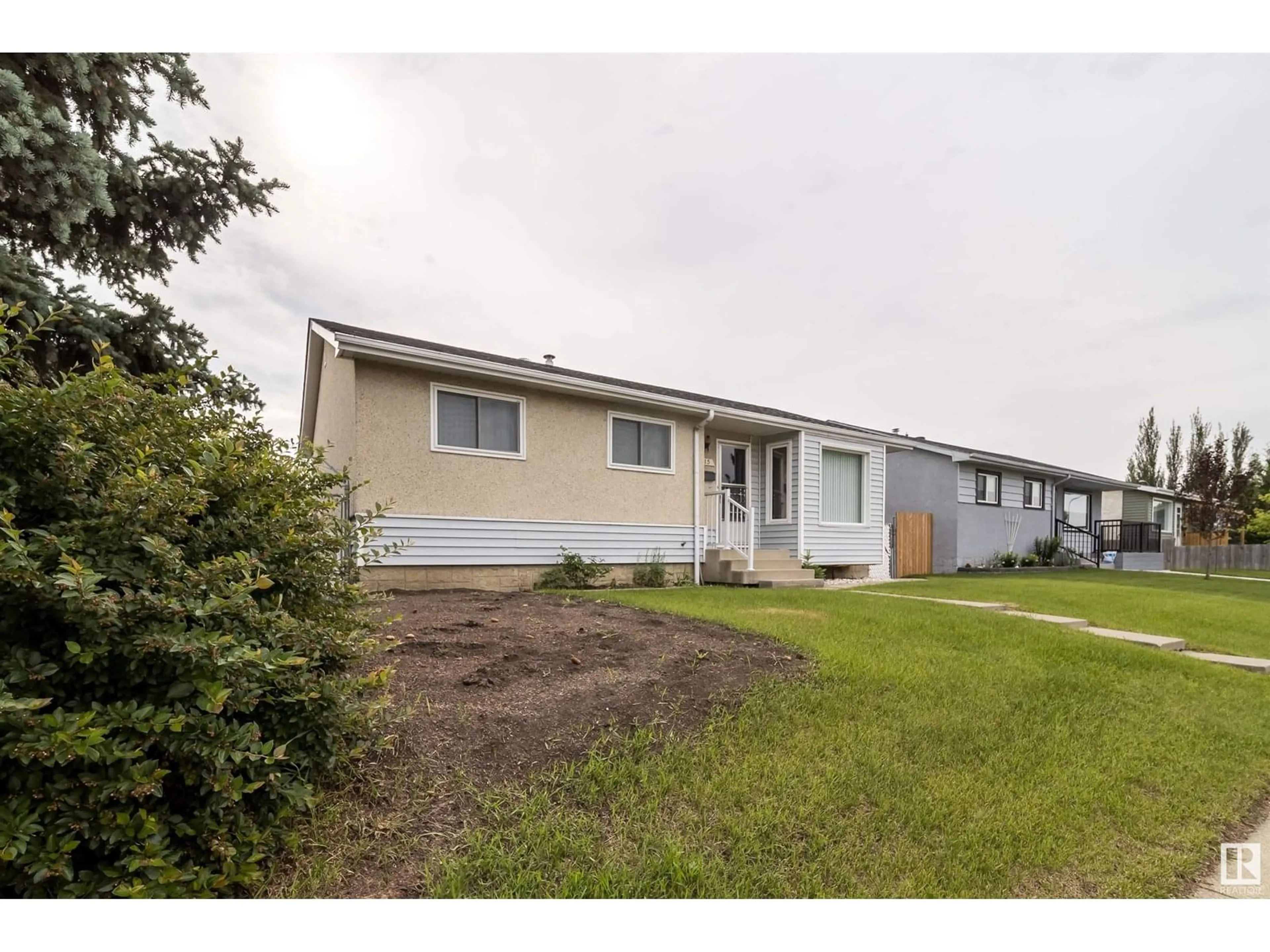 Home with vinyl exterior material, street for NW - 13415 67 ST, Edmonton Alberta T5C0C6