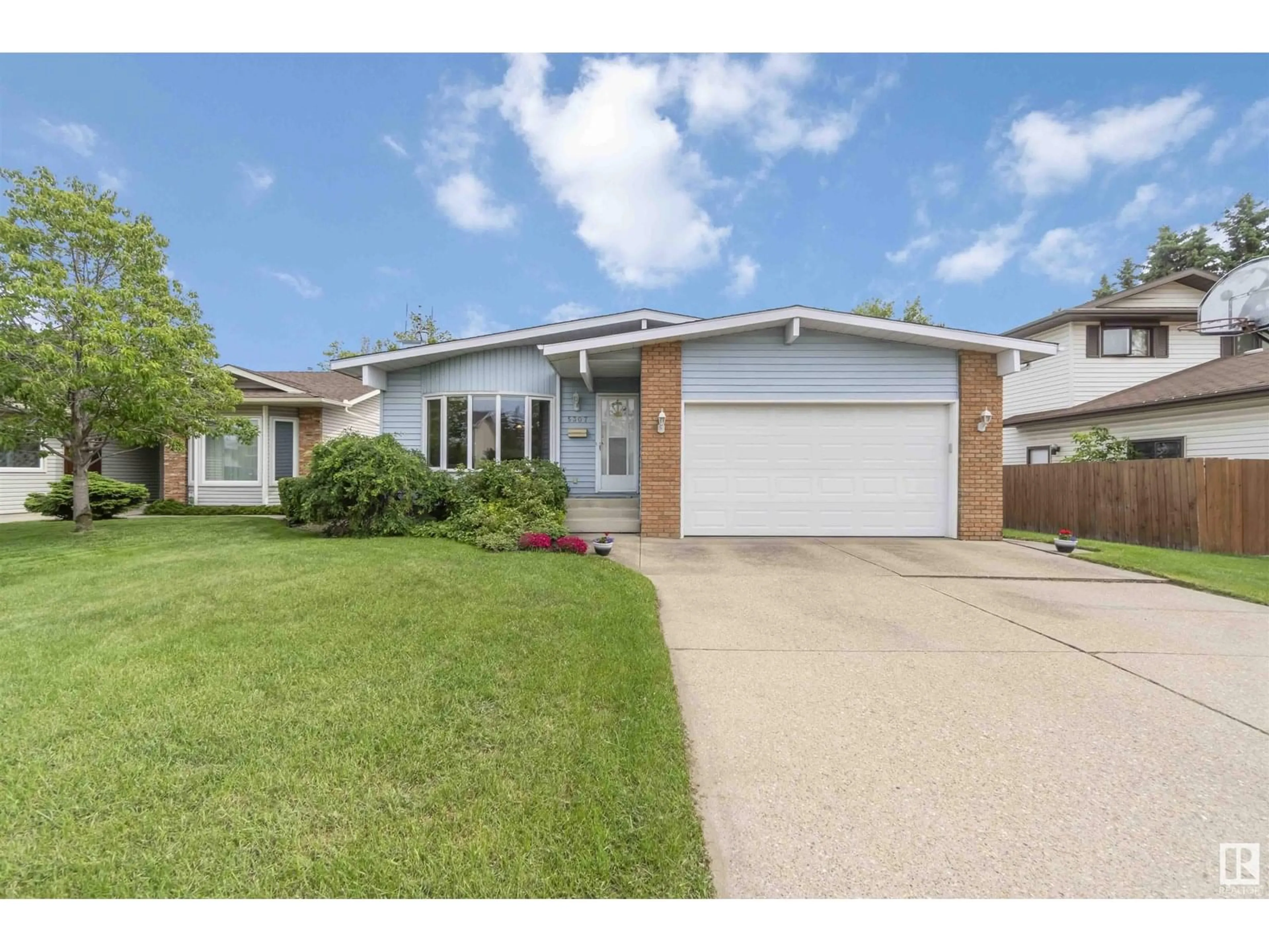 Home with vinyl exterior material, street for 5307 139 AV, Edmonton Alberta T5A4R4
