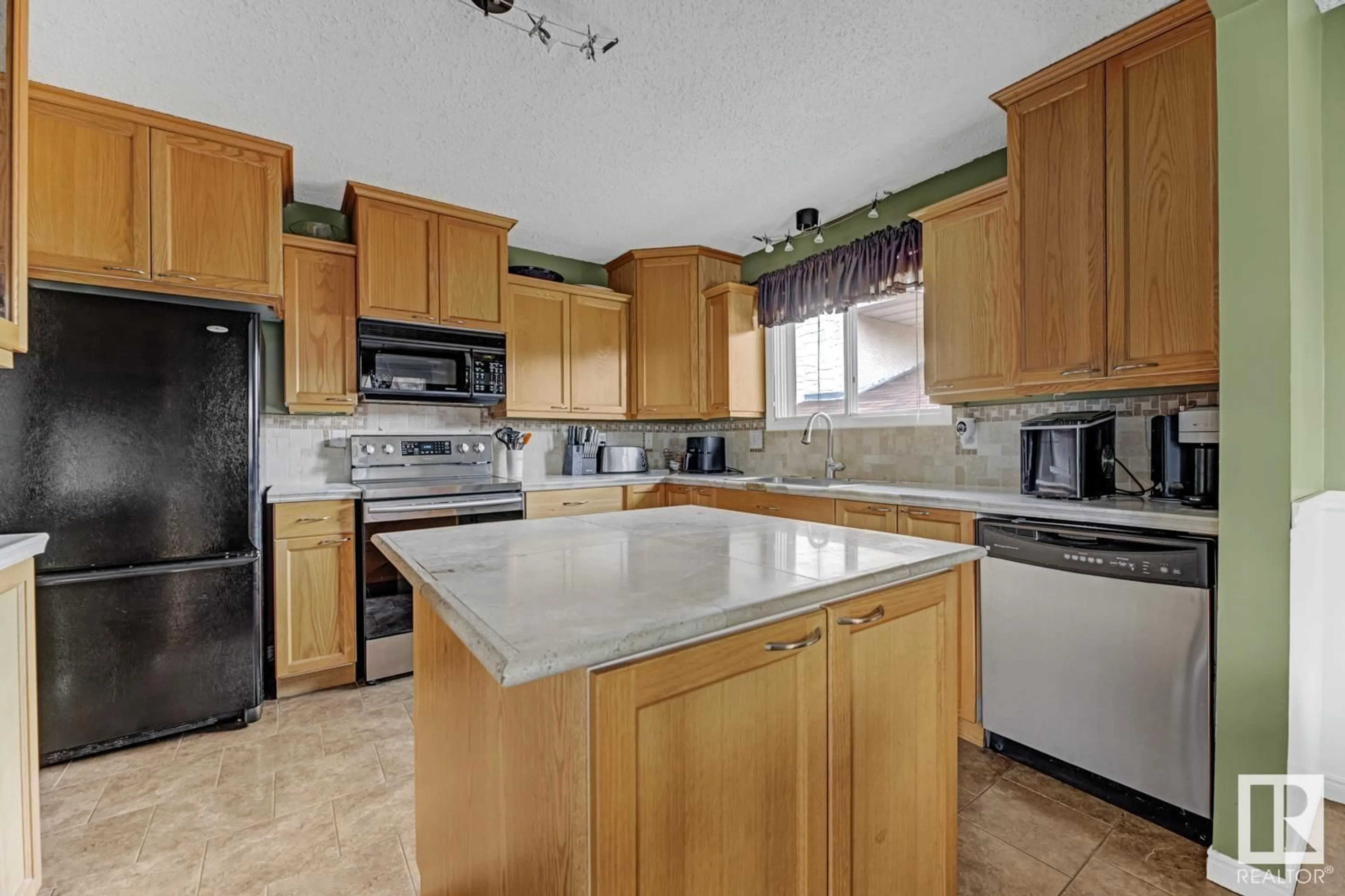 Standard kitchen, ceramic/tile floor for 4711 38A AV, Edmonton Alberta T6L5B6