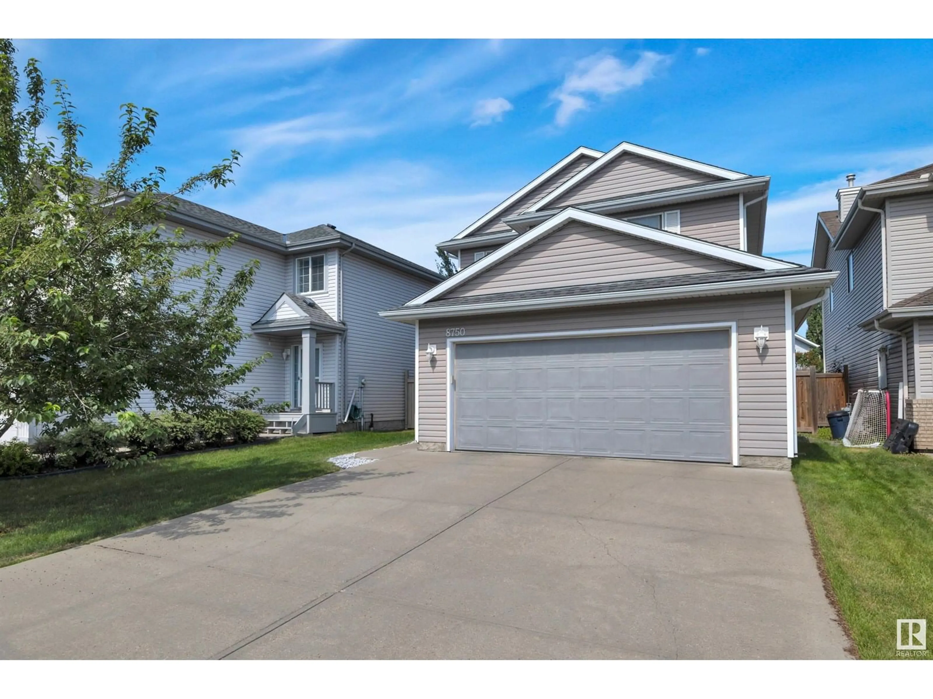 Home with vinyl exterior material, street for 8750 5 AV, Edmonton Alberta T6X1E2