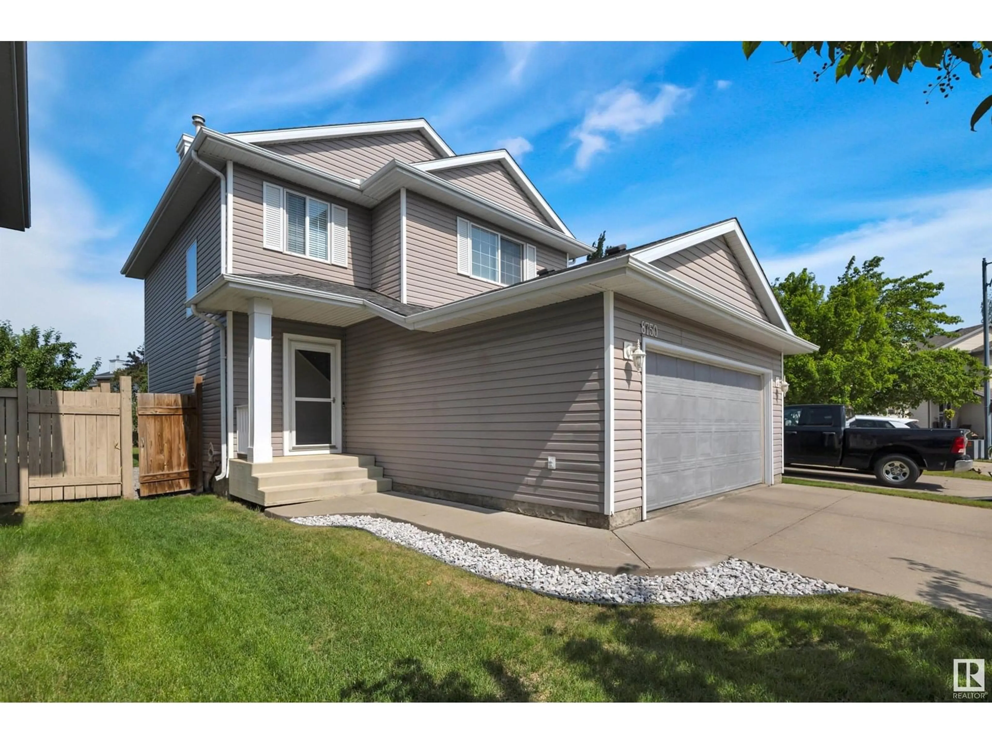 Home with vinyl exterior material, street for 8750 5 AV, Edmonton Alberta T6X1E2