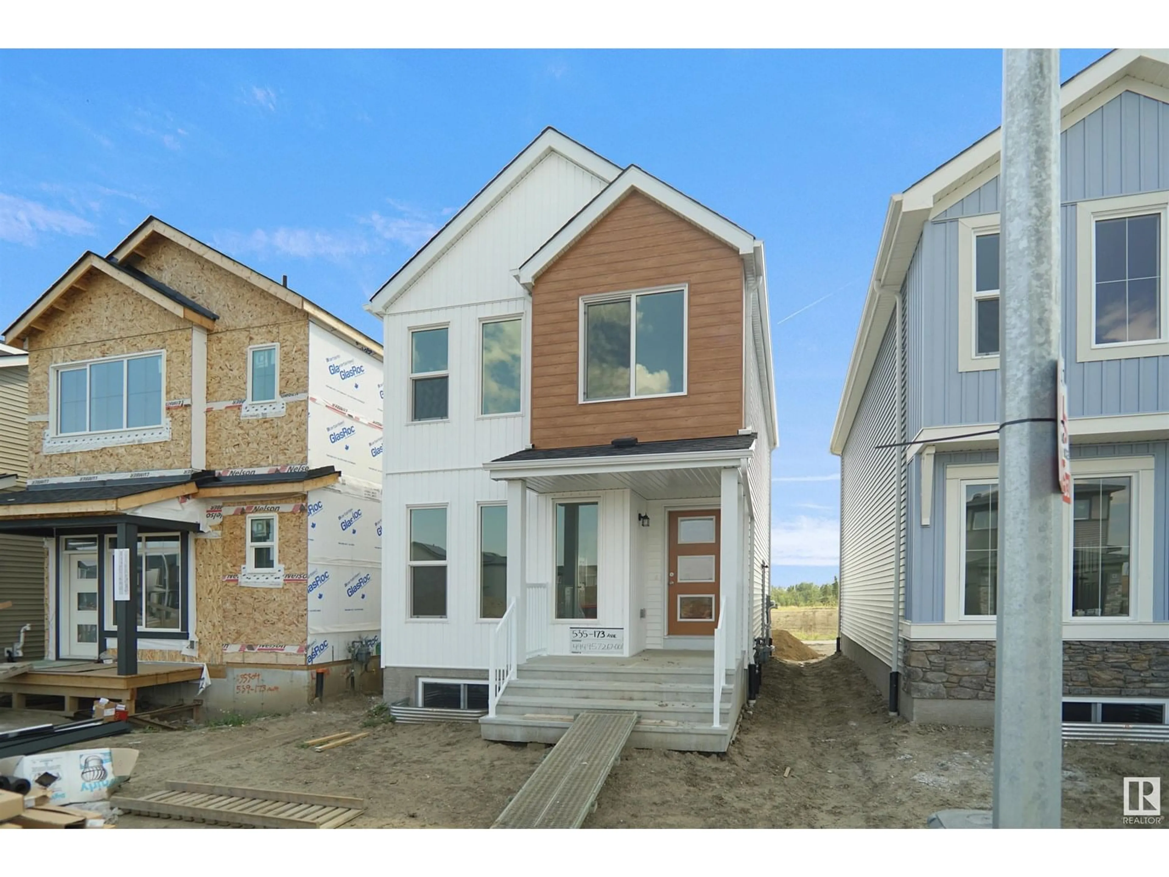 Home with vinyl exterior material, street for 20919 16 AV, Edmonton Alberta T6M1L2