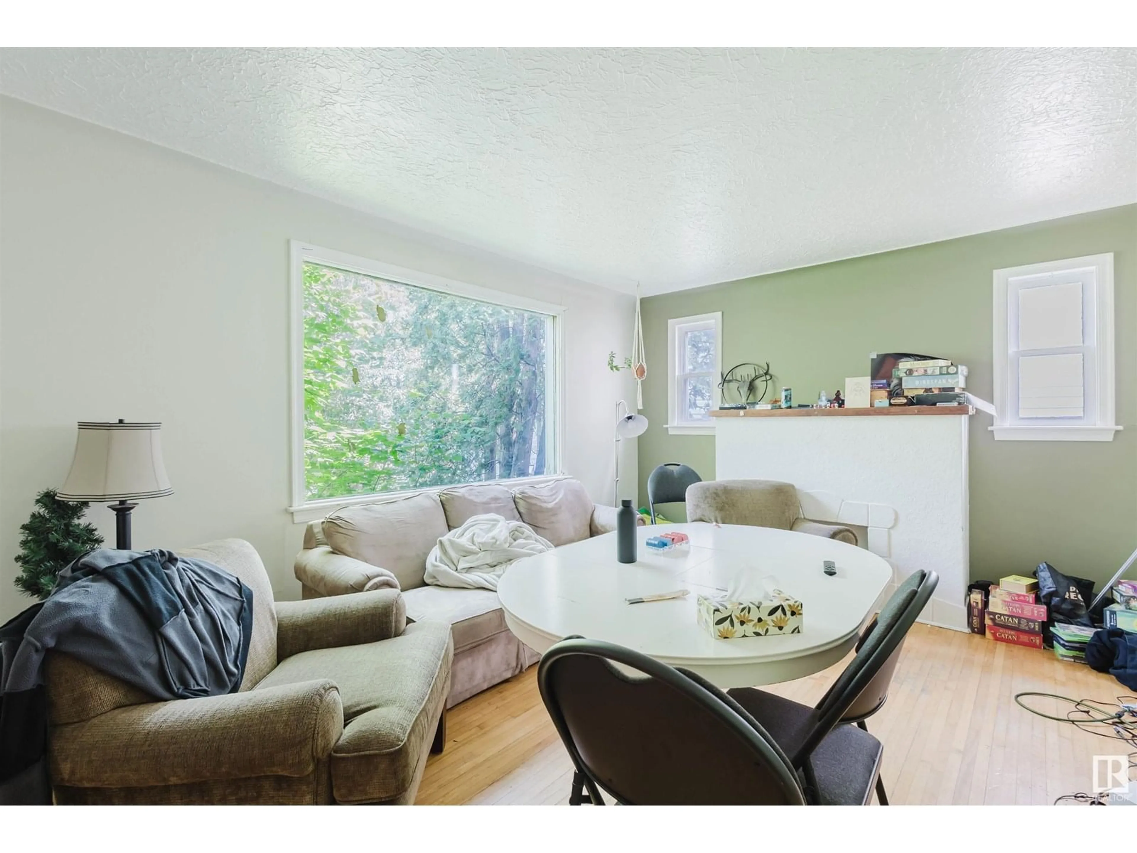 Living room with furniture, wood/laminate floor for 7230 112 ST, Edmonton Alberta T6G1J3