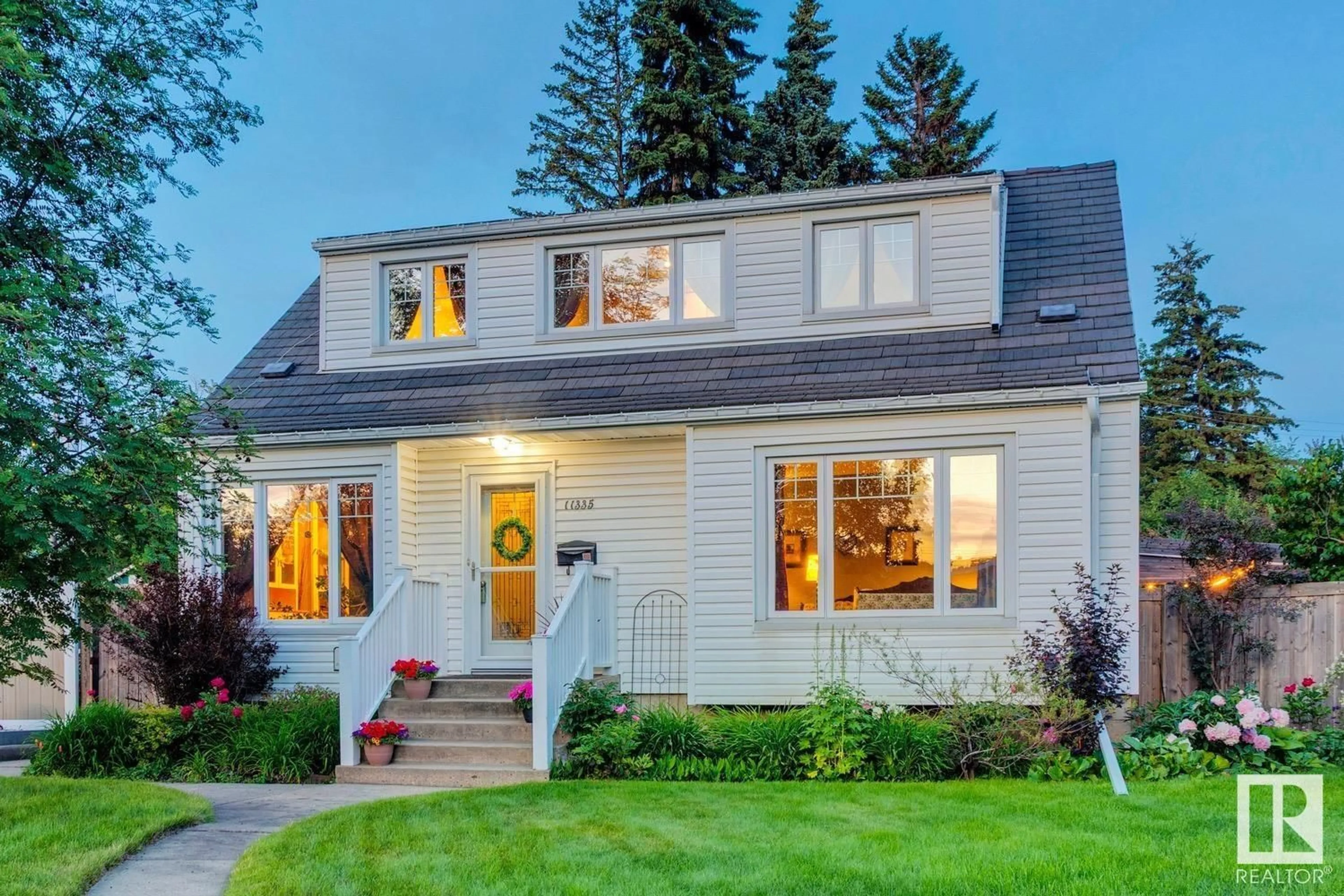 Home with vinyl exterior material, street for NW - 11335 54 ST, Edmonton Alberta T5W3M6