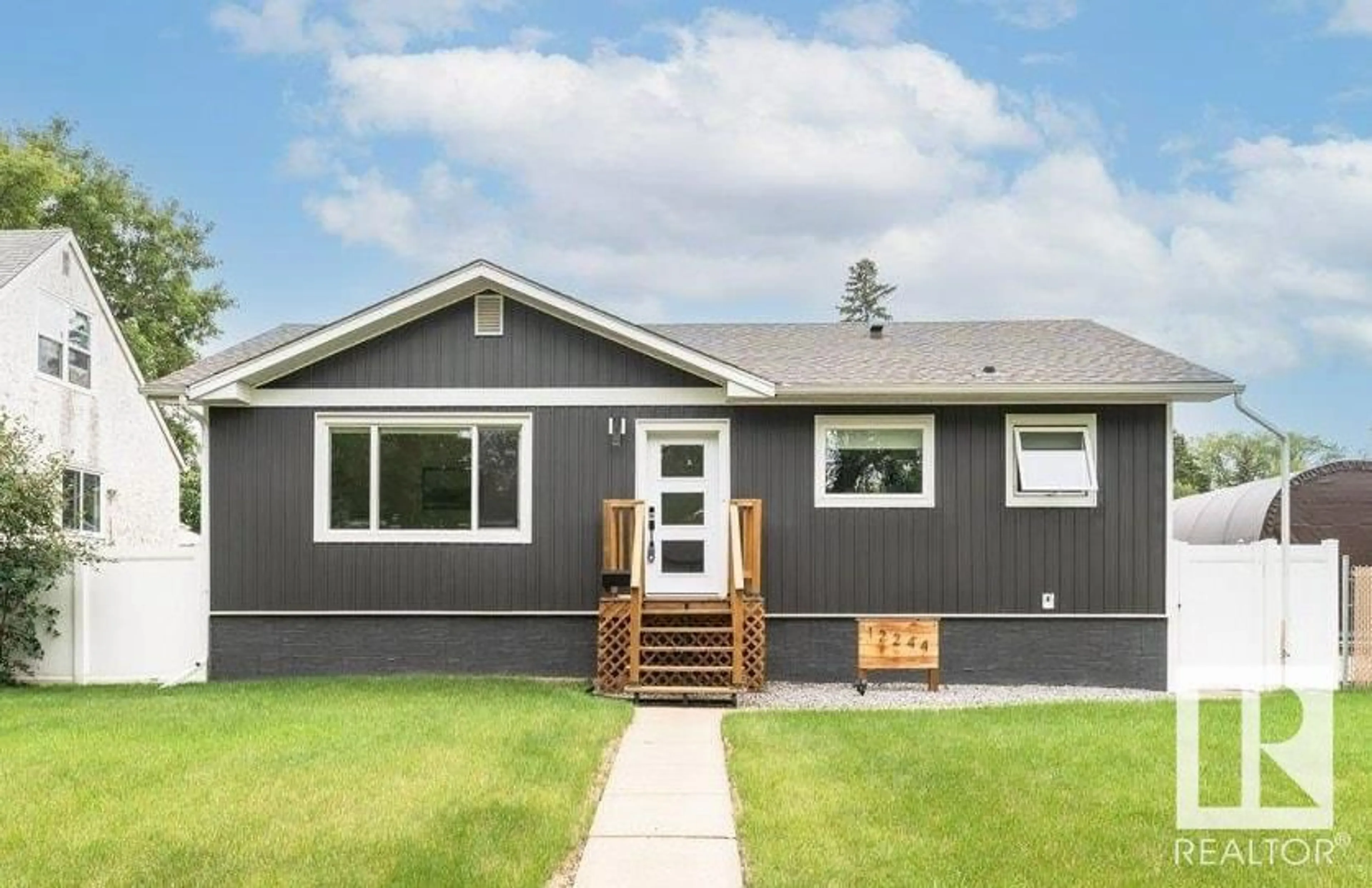 Home with vinyl exterior material, street for 12244 135 ST, Edmonton Alberta T5L1X1