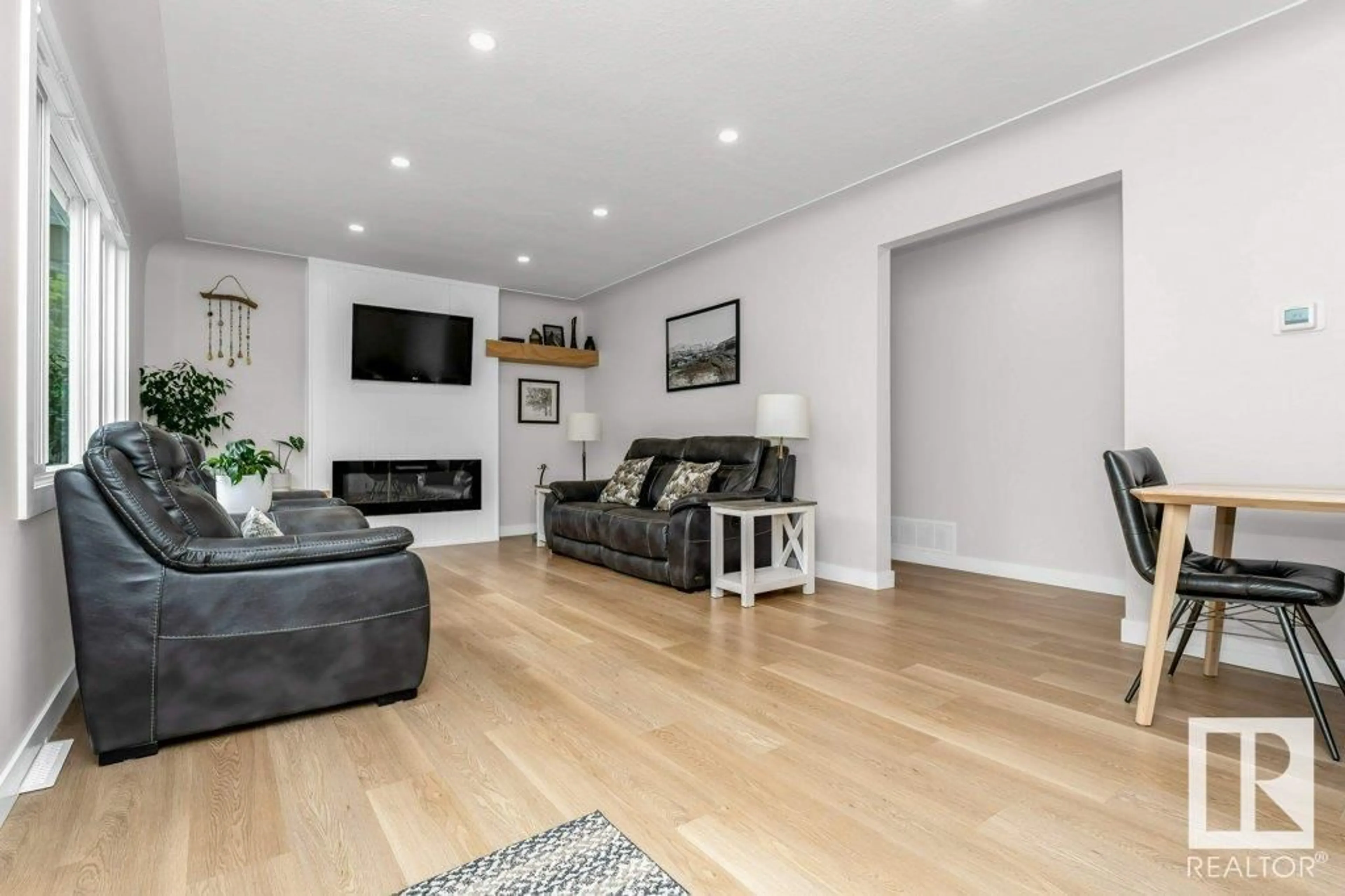 Living room with furniture, wood/laminate floor for 12244 135 ST, Edmonton Alberta T5L1X1