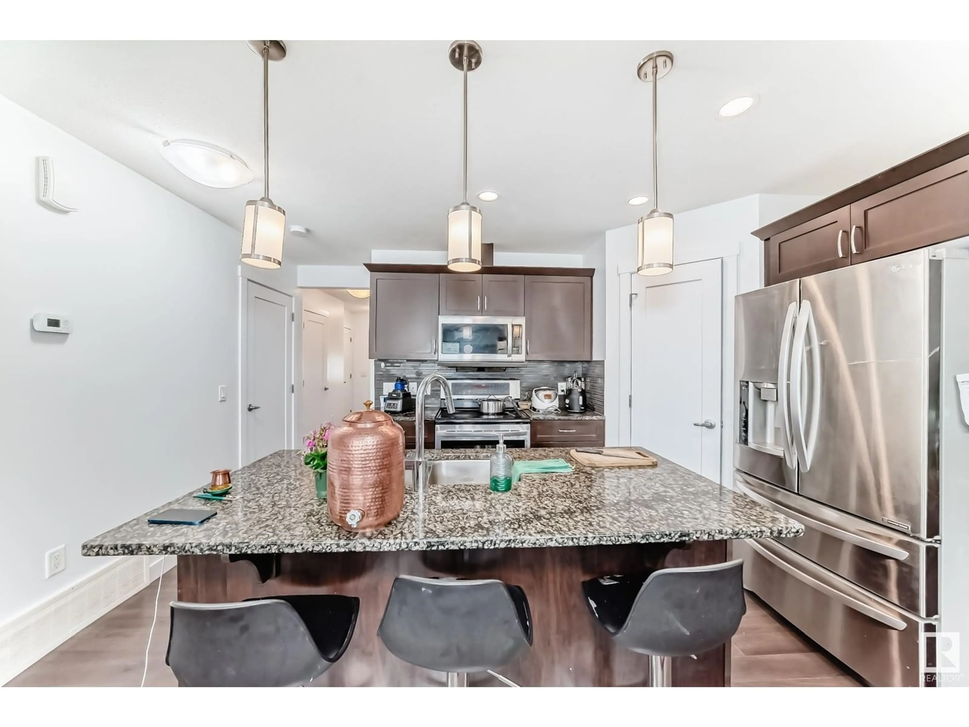 Open concept kitchen, ceramic/tile floor for 20315 43 AV NW, Edmonton Alberta T6M0R8