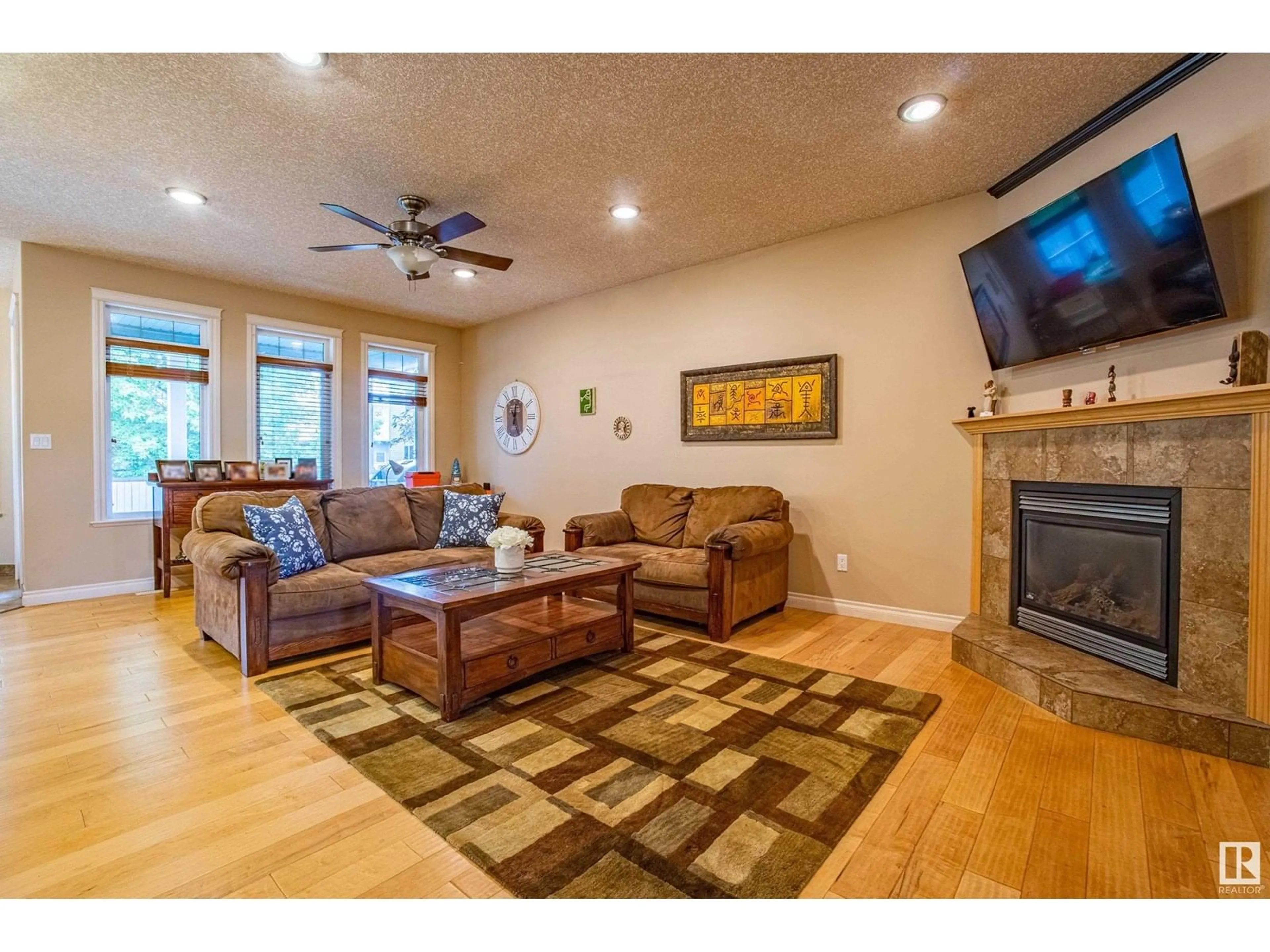 Living room with furniture, wood/laminate floor for 17 KING ST, Leduc Alberta T9E0A3