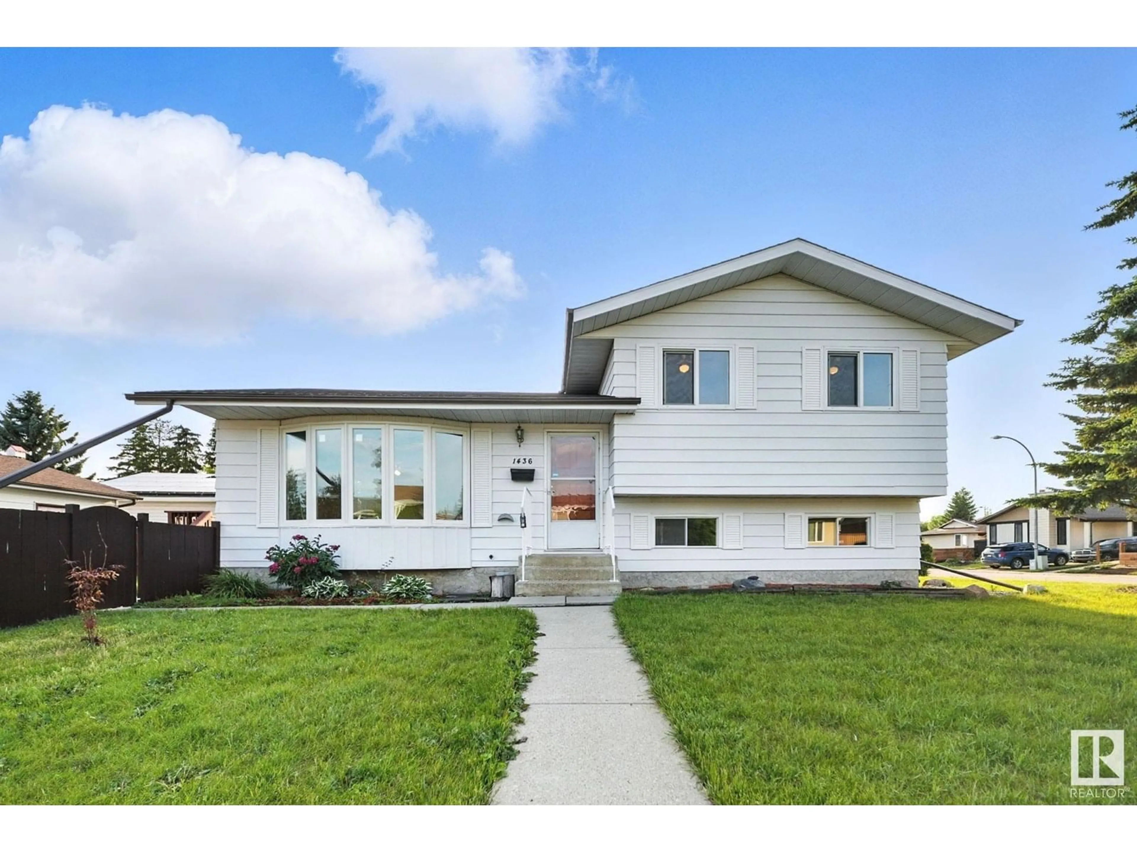 Home with vinyl exterior material, street for 1436 63 ST, Edmonton Alberta T6L1X7