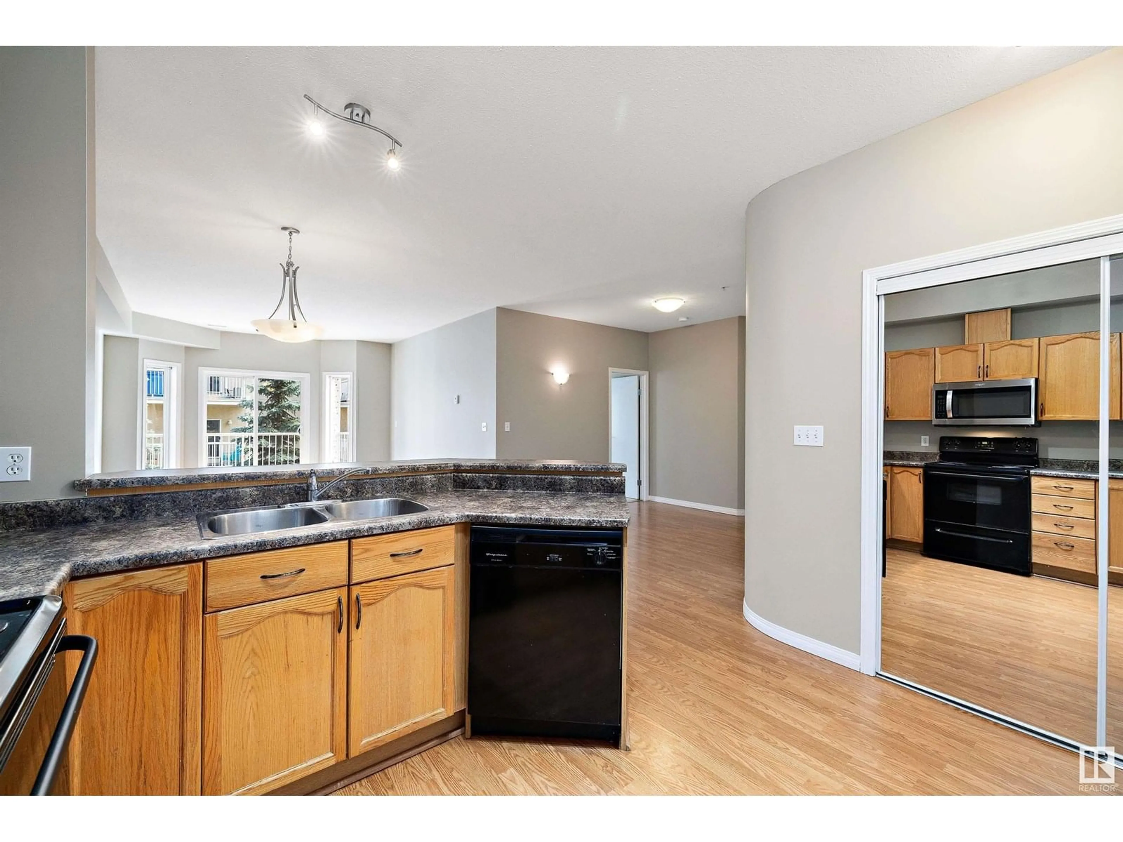 Open concept kitchen, unknown for #211 - 4304 139 AV, Edmonton Alberta T5Y0H6