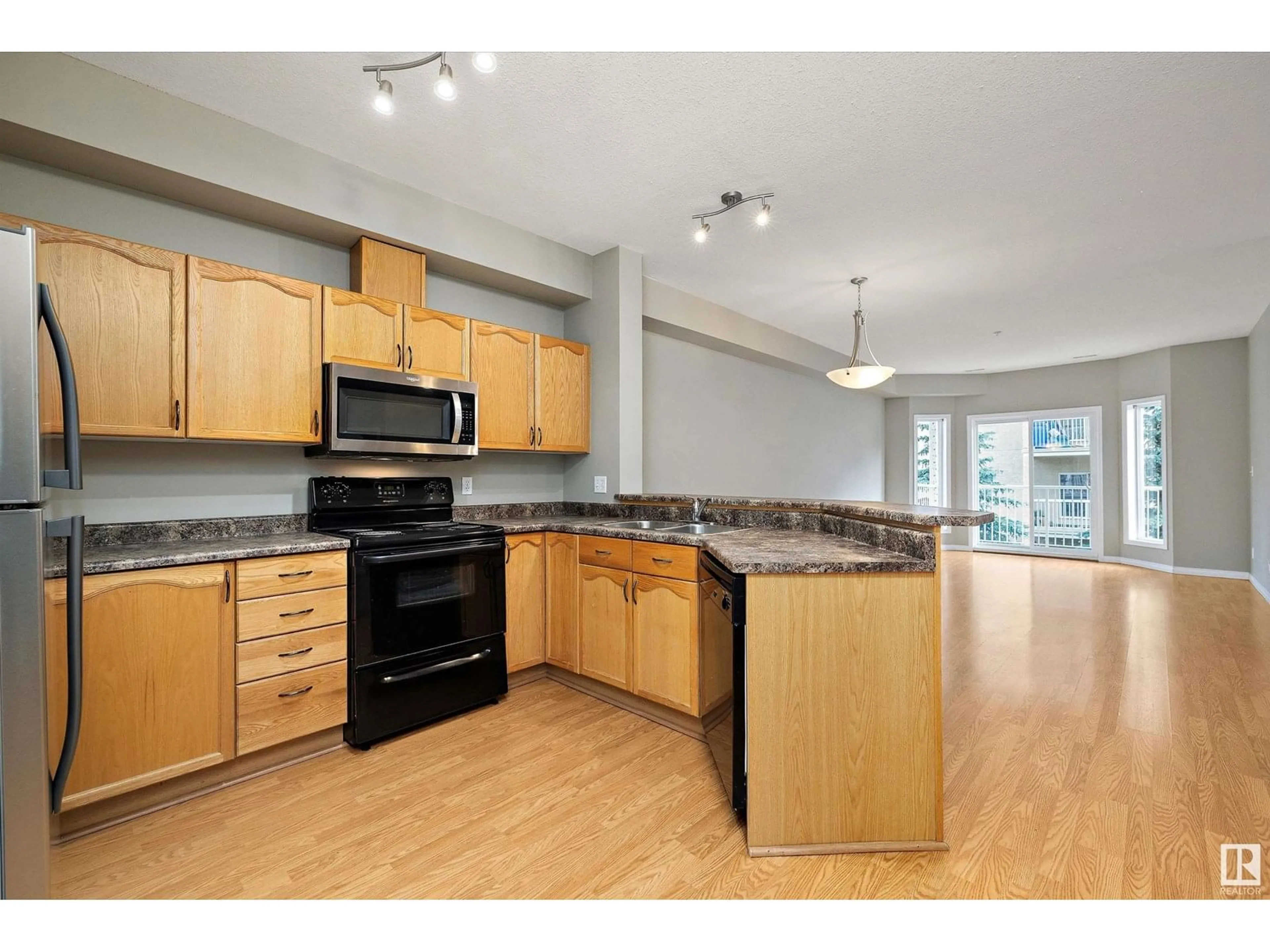 Open concept kitchen, unknown for #211 - 4304 139 AV, Edmonton Alberta T5Y0H6