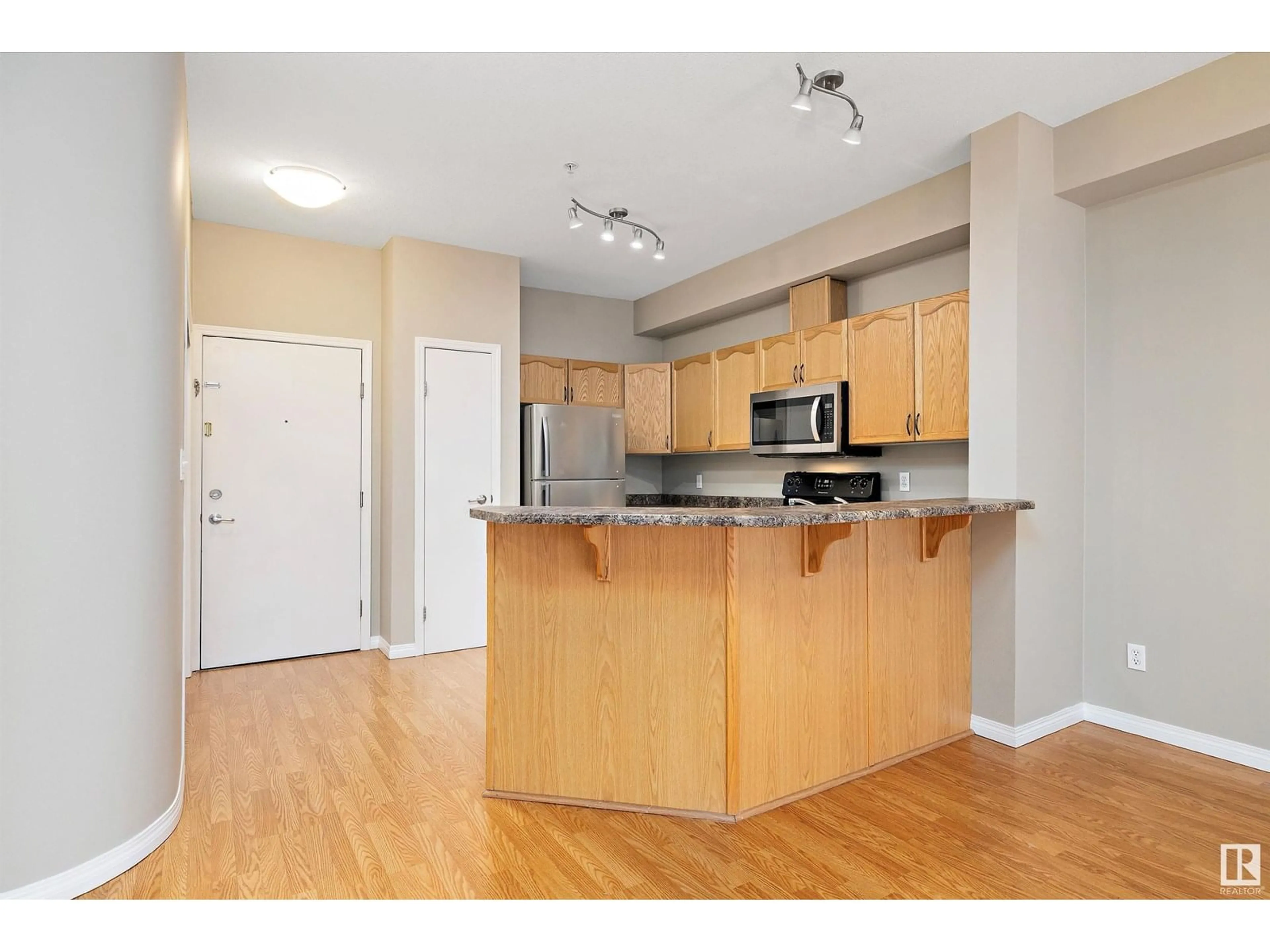Standard kitchen, wood/laminate floor for #211 - 4304 139 AV, Edmonton Alberta T5Y0H6