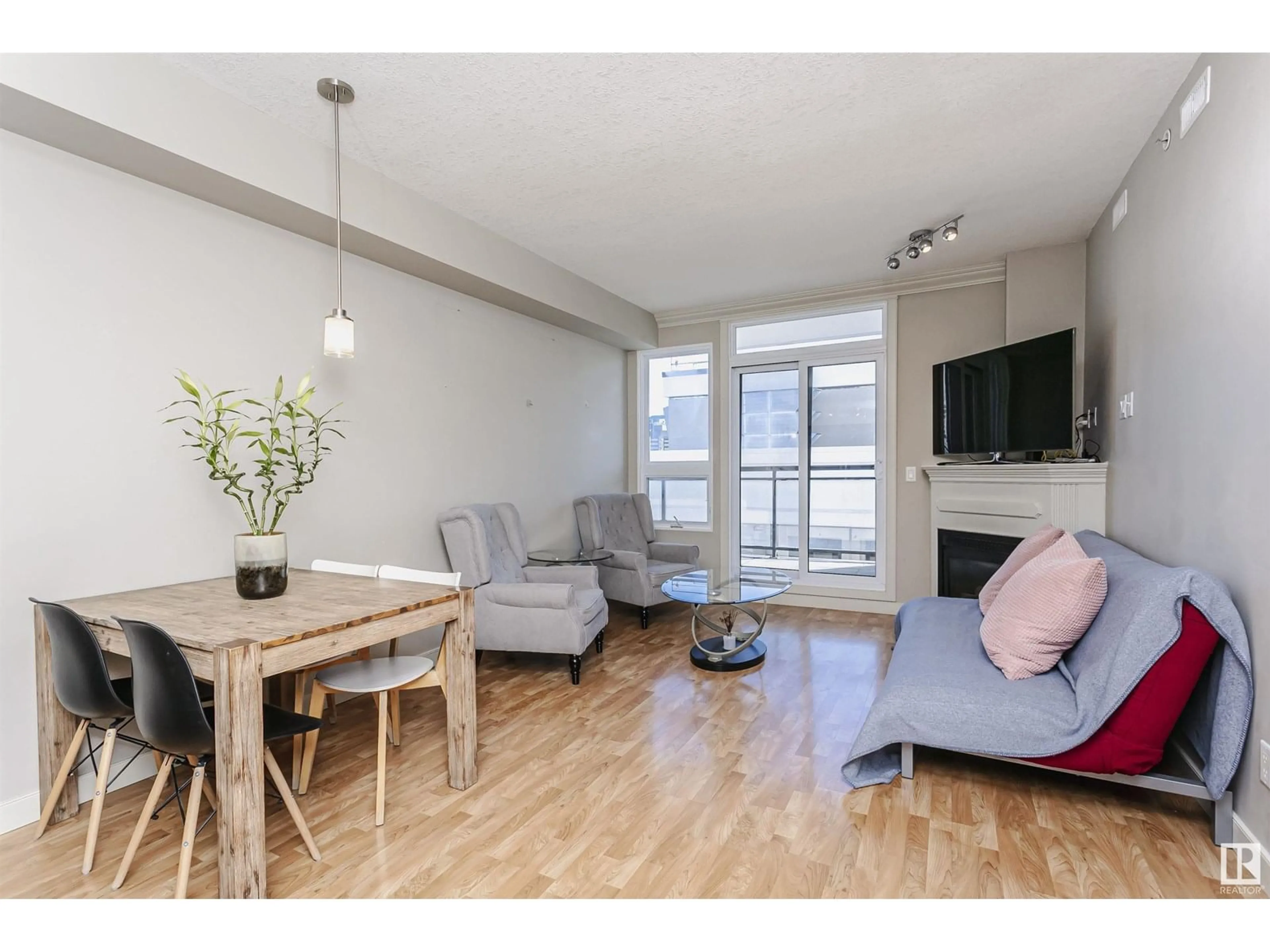 Living room with furniture, wood/laminate floor for 9939 - 1703 109 ST, Edmonton Alberta T5K1H6
