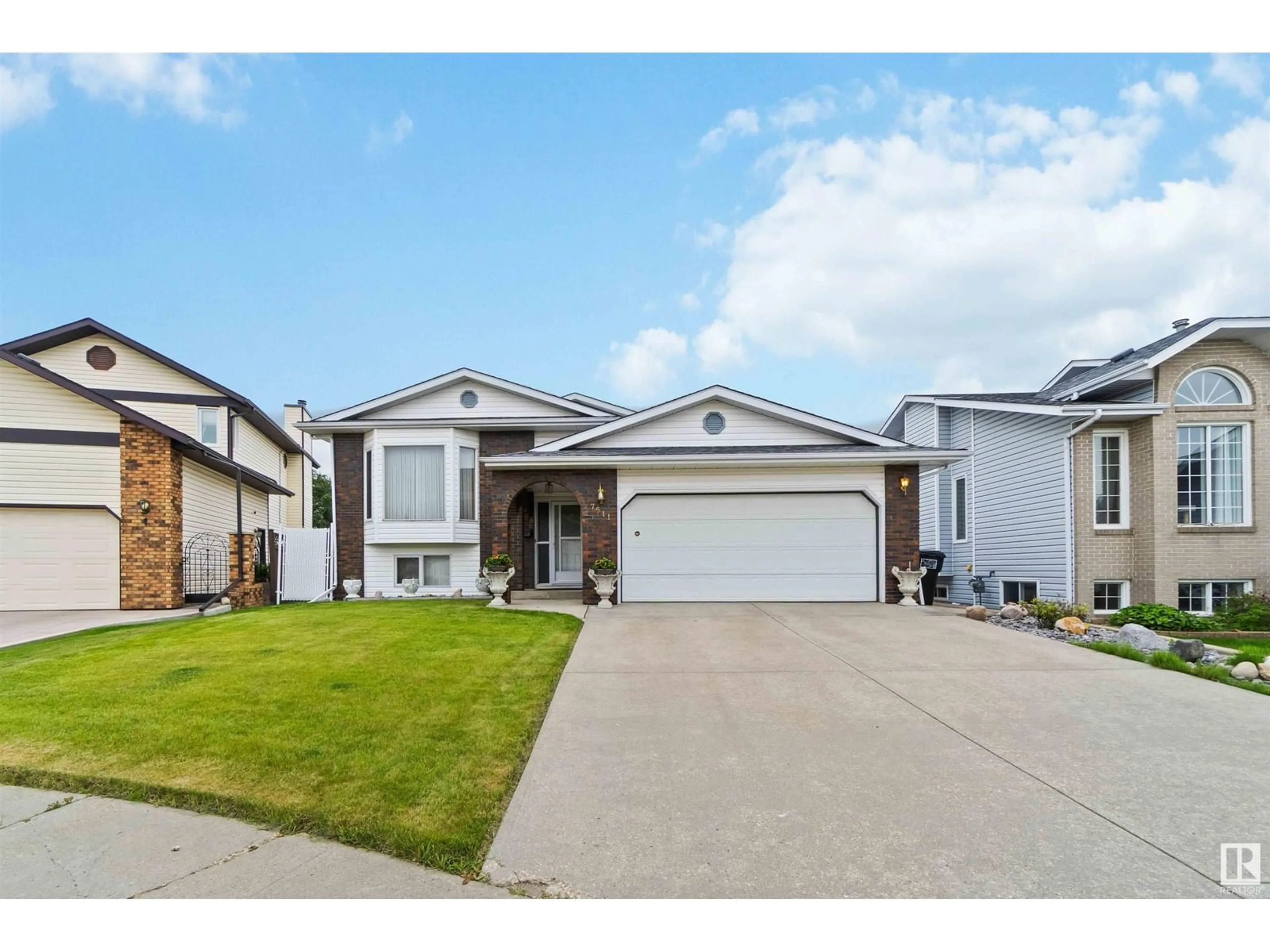 Home with vinyl exterior material, street for 7511 158 A AV, Edmonton Alberta T5Z2W4