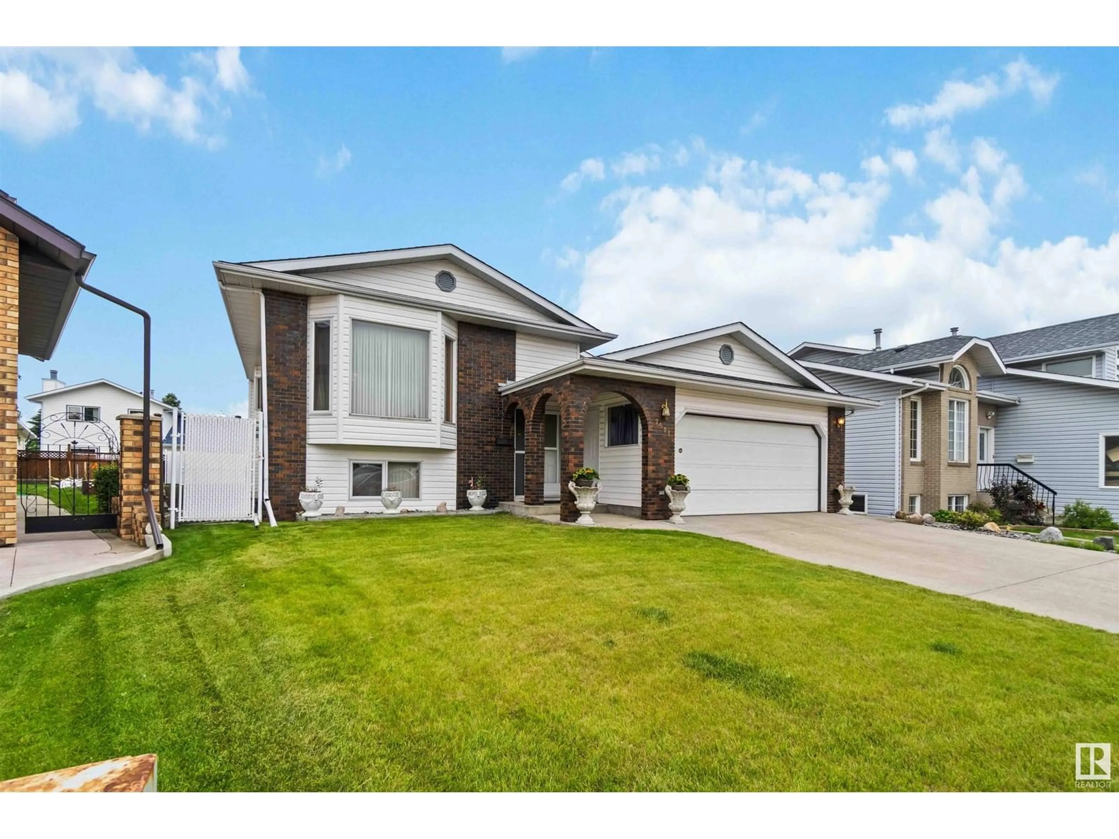 Home with vinyl exterior material, street for 7511 158 A AV, Edmonton Alberta T5Z2W4
