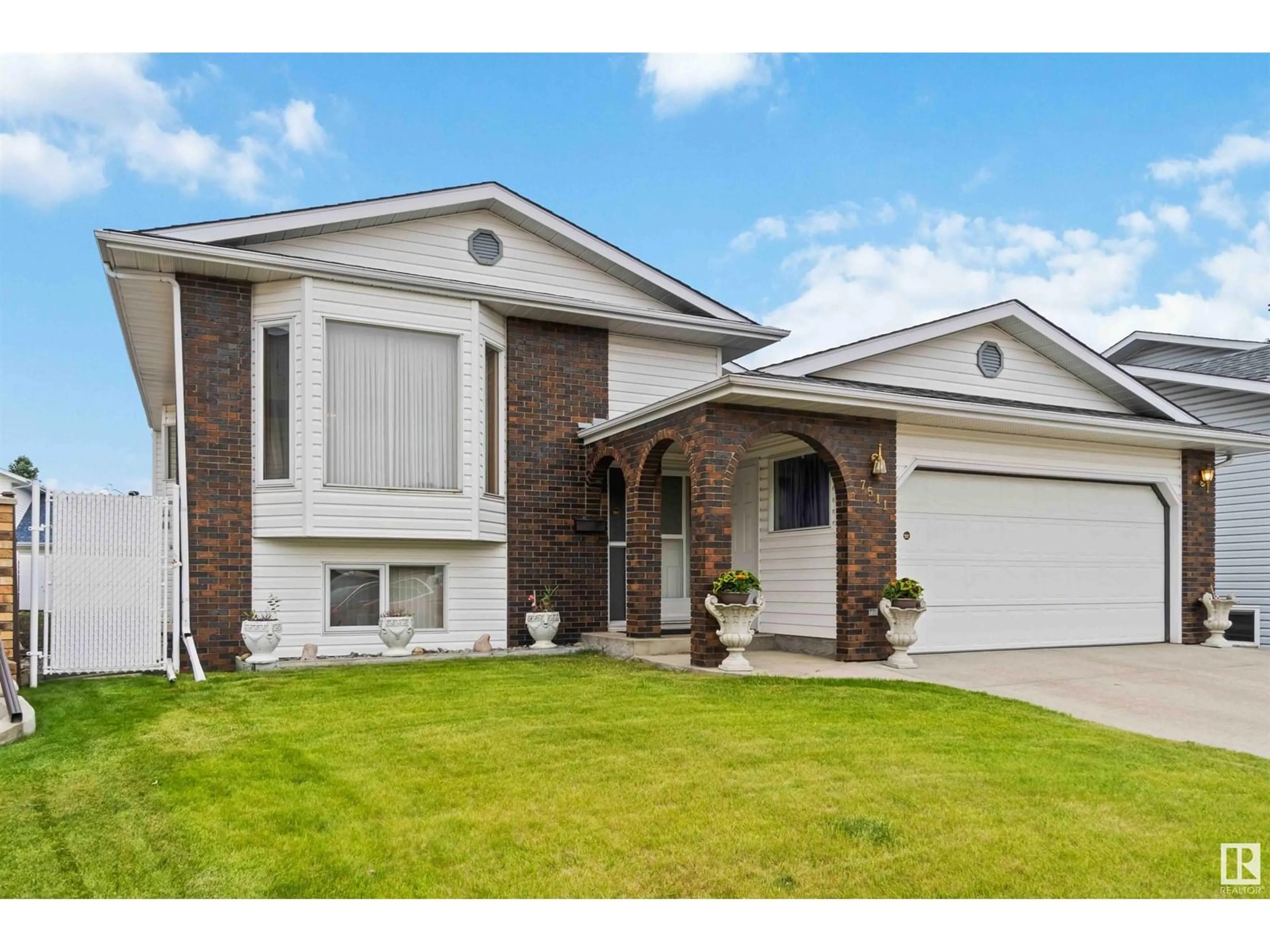 Home with vinyl exterior material, street for 7511 158 A AV, Edmonton Alberta T5Z2W4