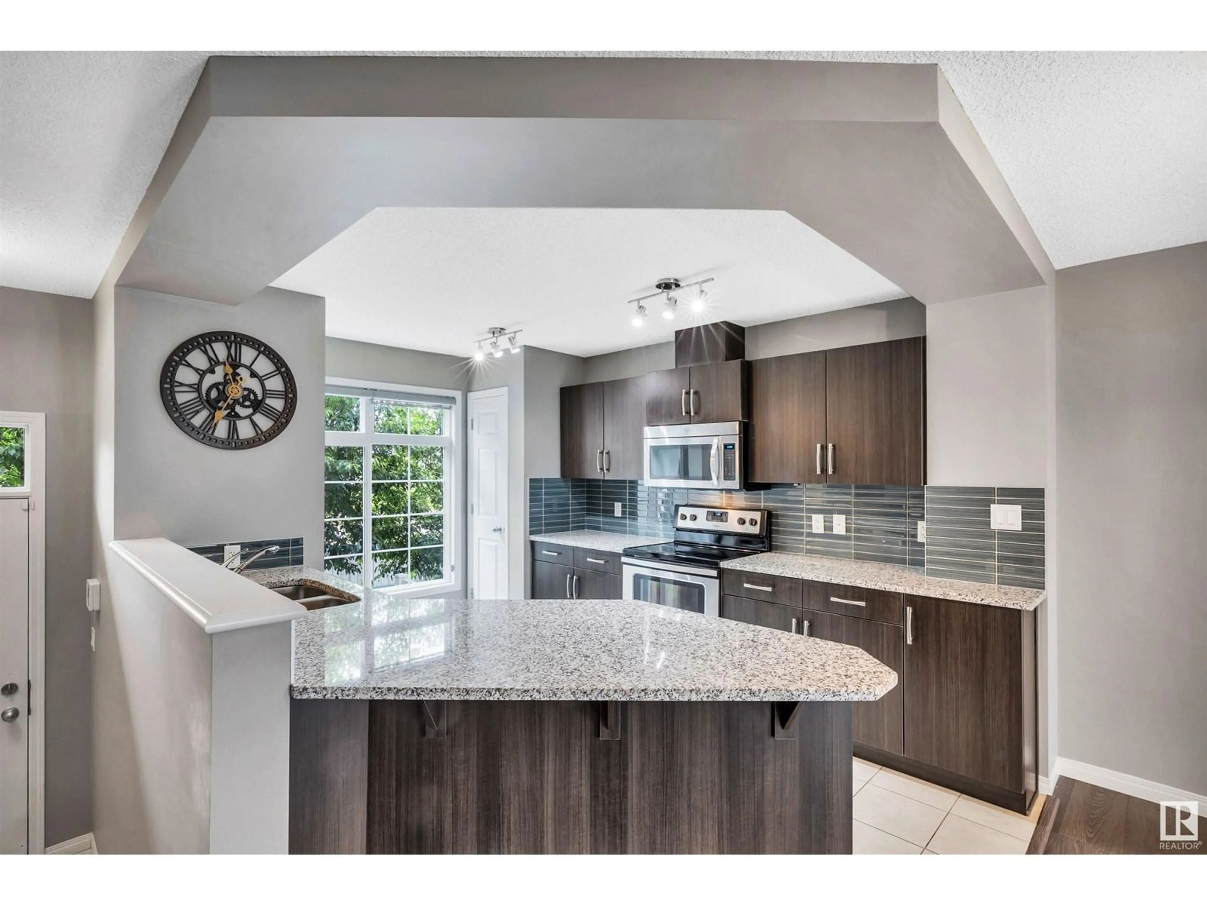 Open concept kitchen, ceramic/tile floor for 9151 - 51 SHAW WY, Edmonton Alberta T6X1W7