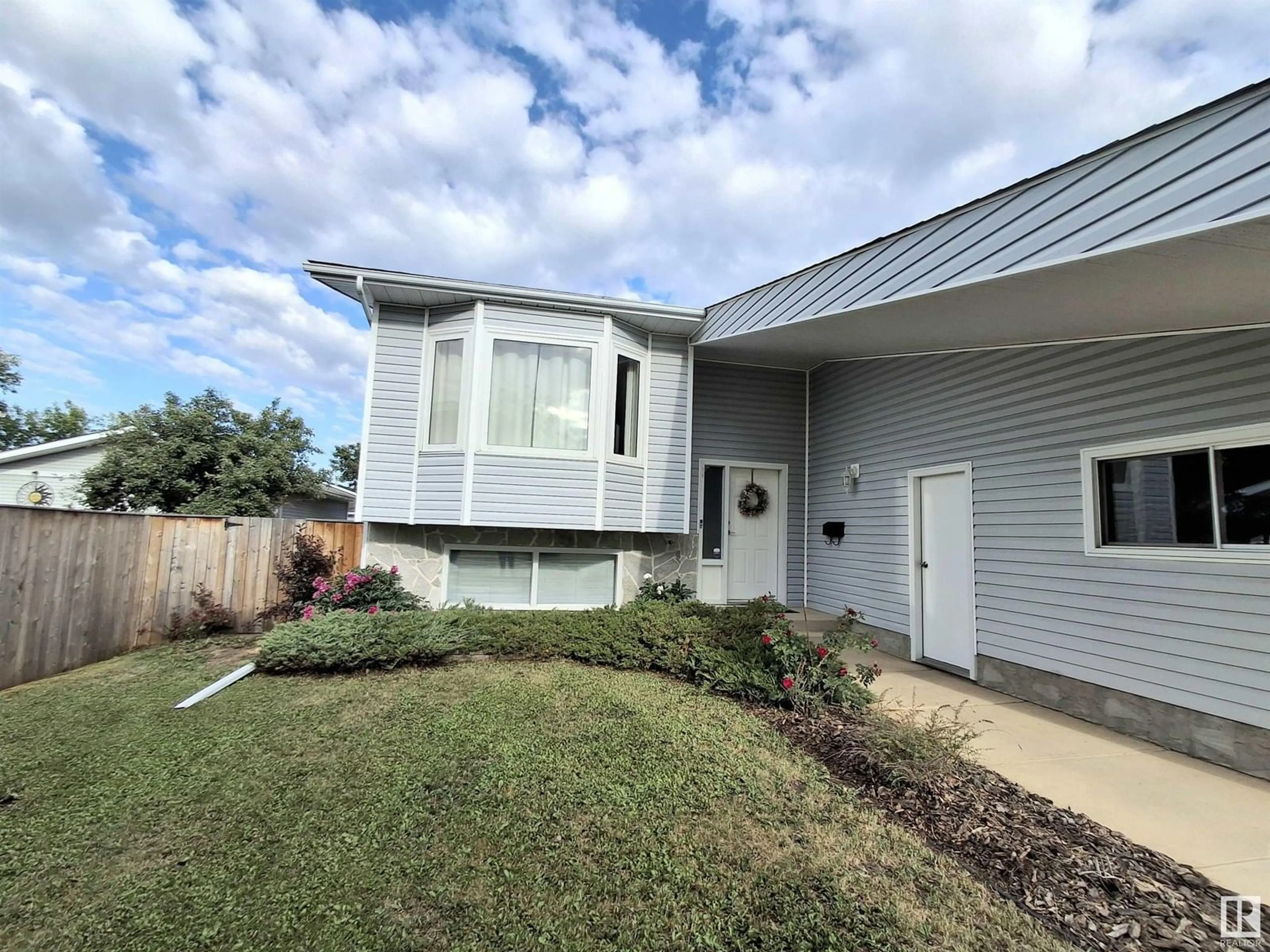 Home with vinyl exterior material, street for 5914 52 ST, Vegreville Alberta T9C1J1