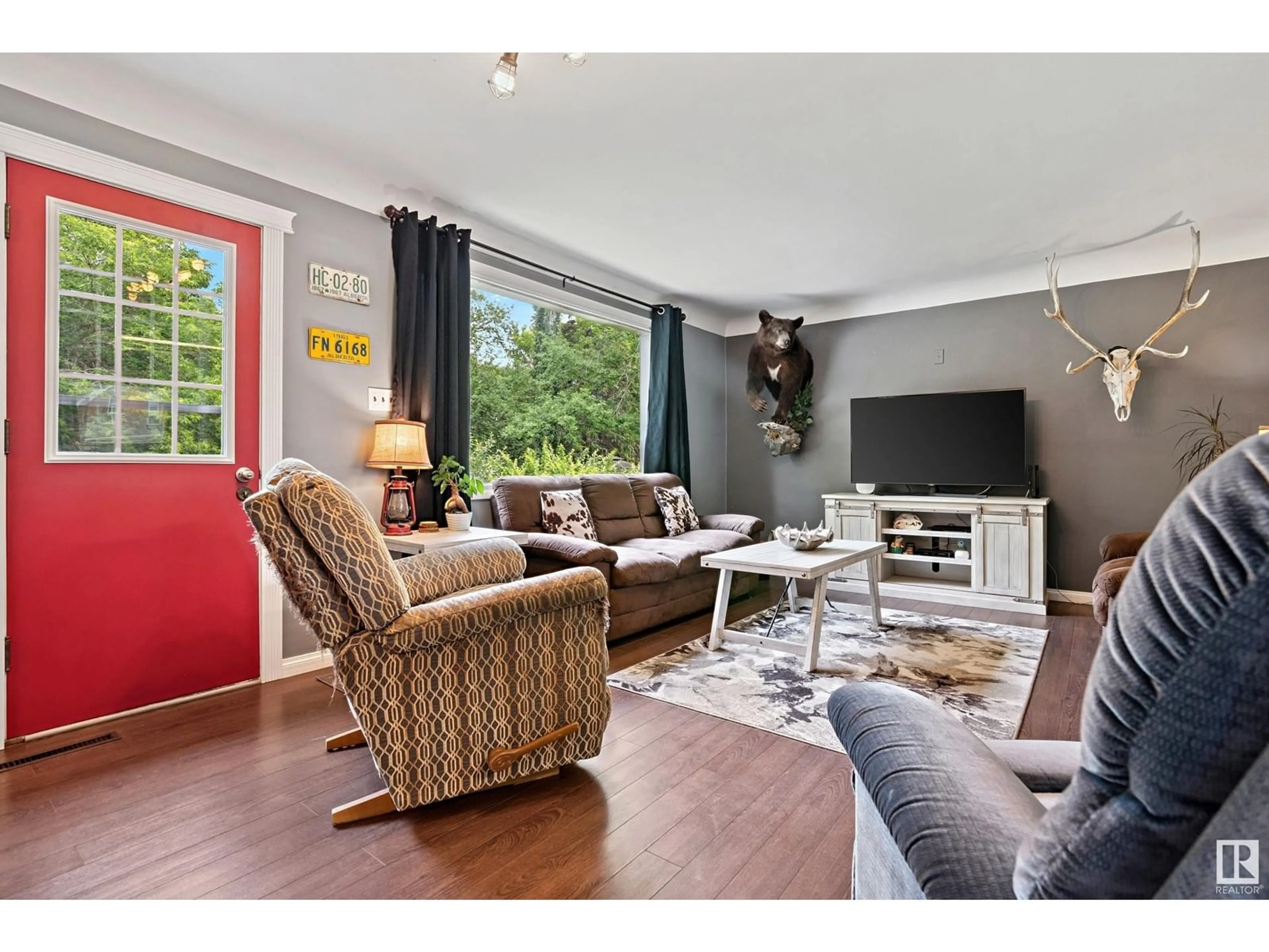 Living room with furniture, wood/laminate floor for 10114 109A ST, Fort Saskatchewan Alberta T8L2K6