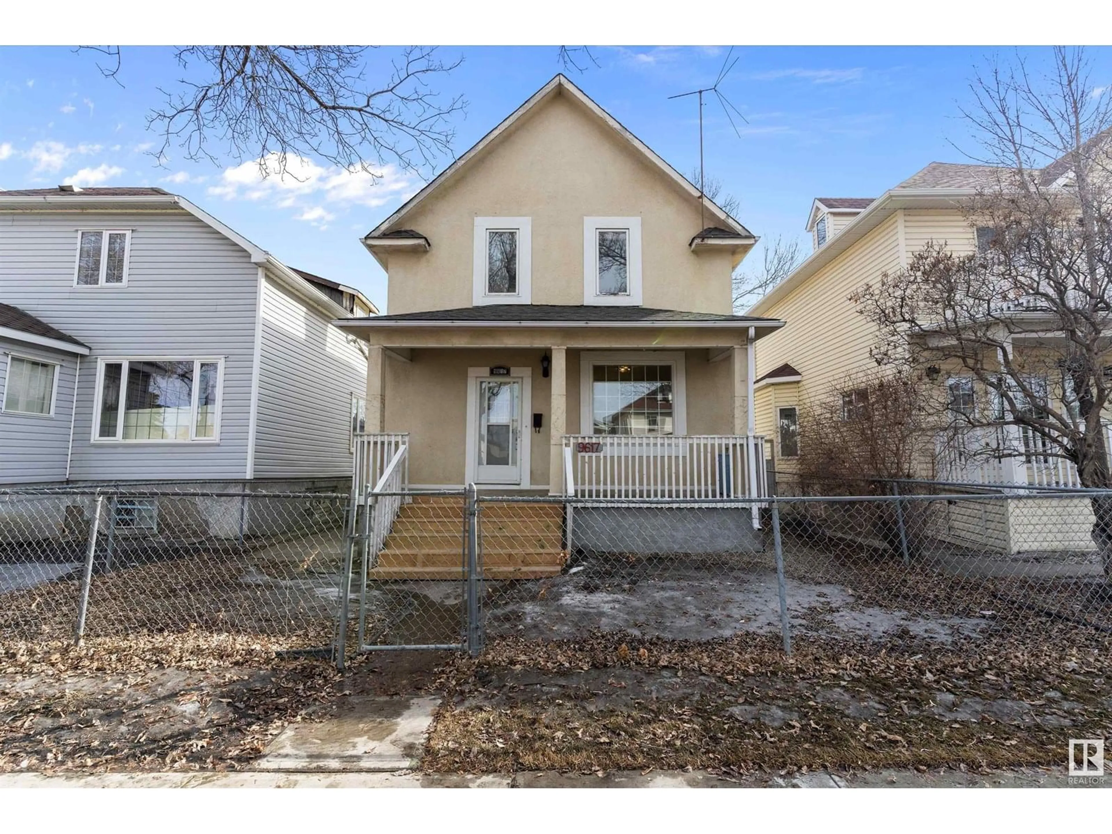 Home with vinyl exterior material, street for 9617 107 AV NW, Edmonton Alberta T5H0T8