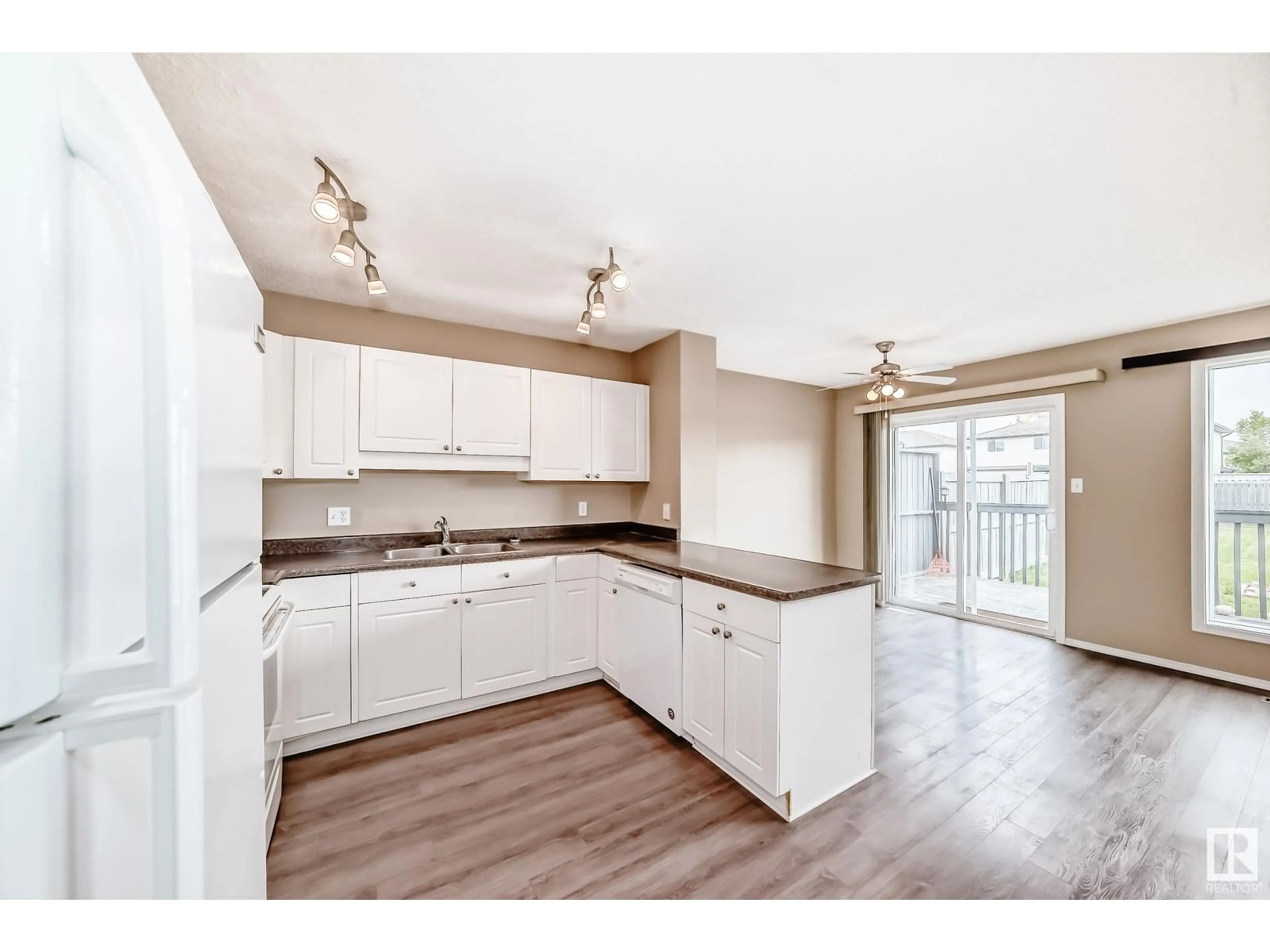 Open concept kitchen, wood/laminate floor for 3018 30 AV, Edmonton Alberta T6T1V2