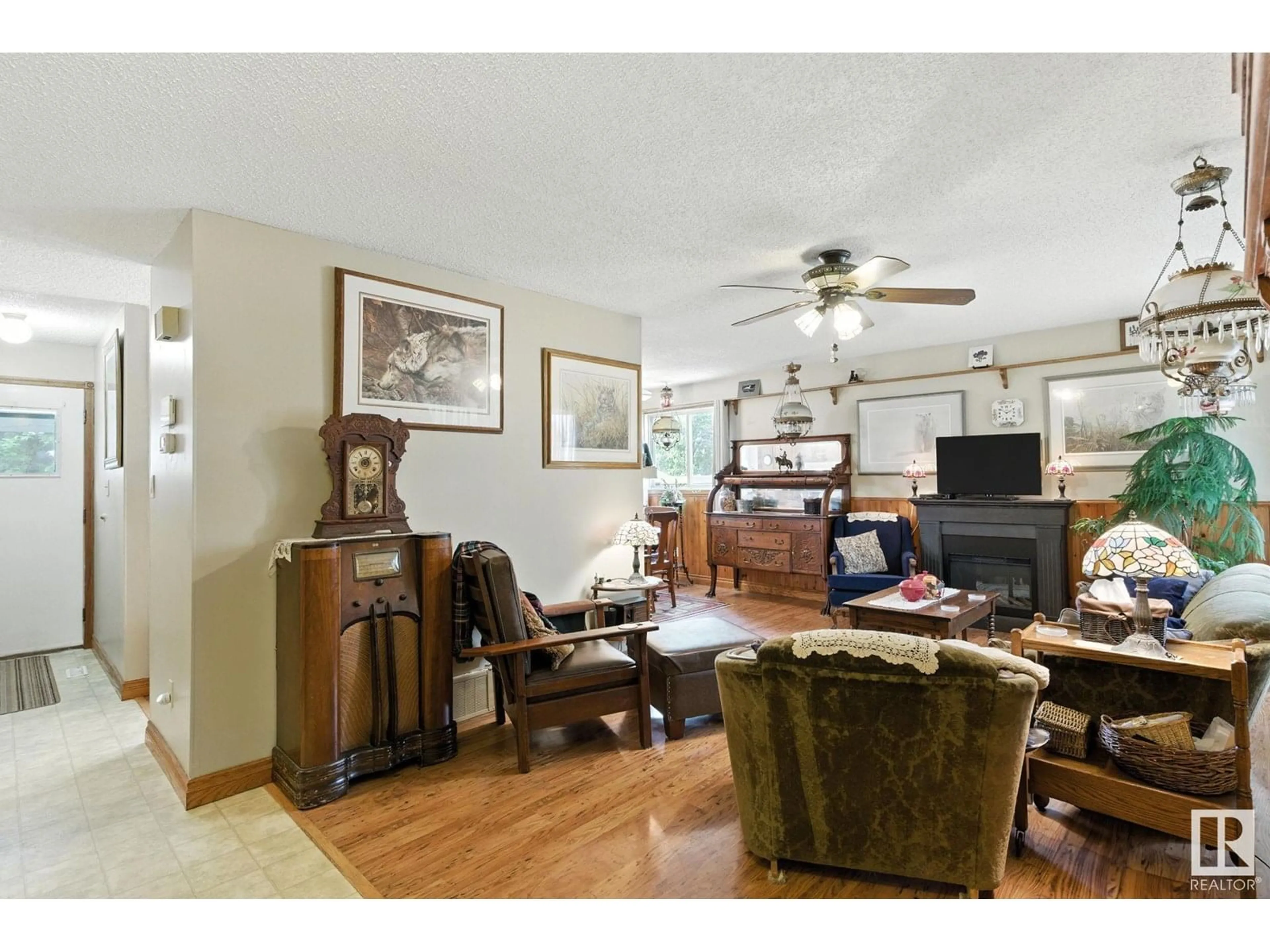 Living room with furniture, wood/laminate floor for 9608 98A ST, Morinville Alberta T8R1H2