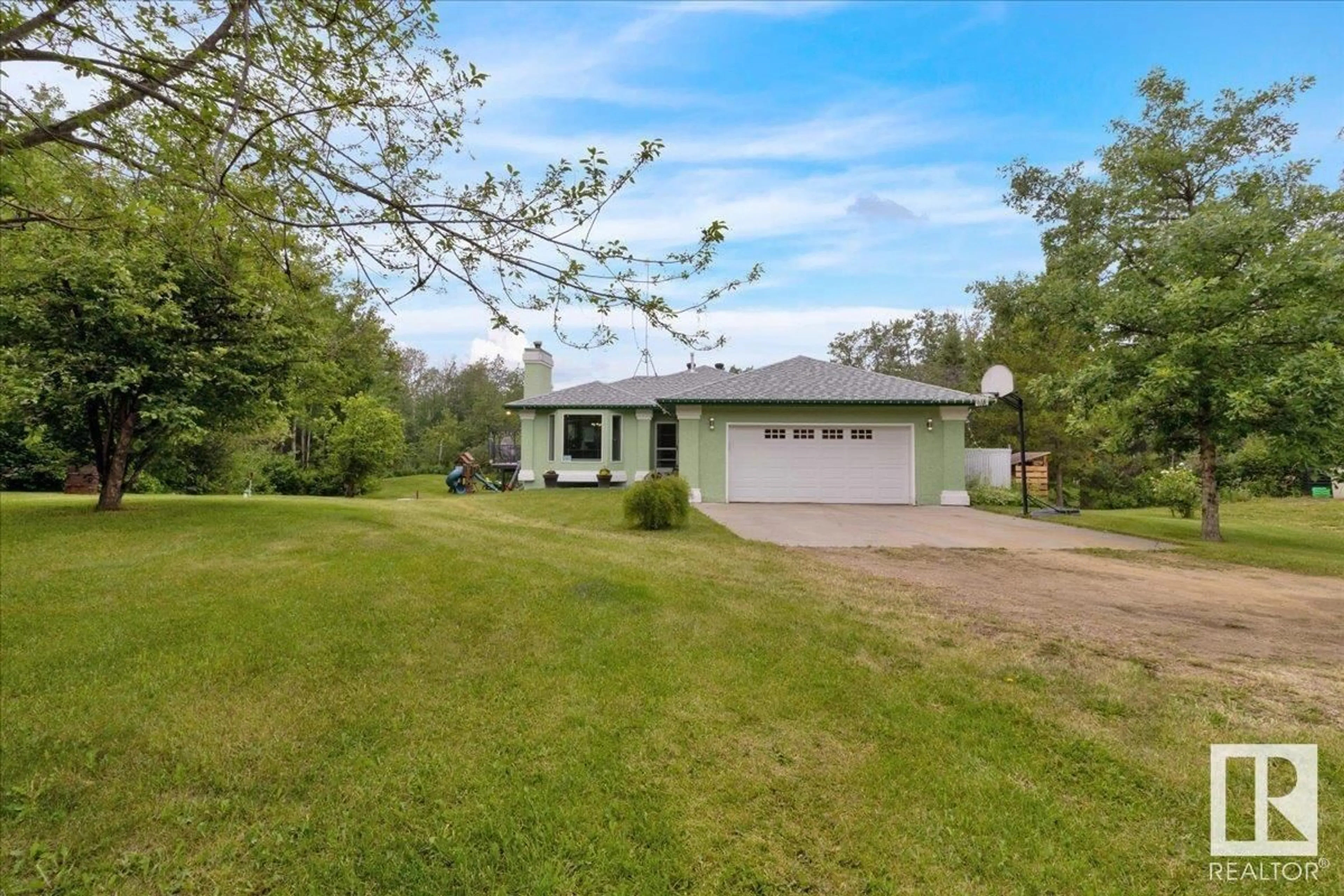 A pic from outside/outdoor area/front of a property/back of a property/a pic from drone, water/lake/river/ocean view for 110 - 50450 RGE ROAD 222, Rural Leduc County Alberta T0B3M0