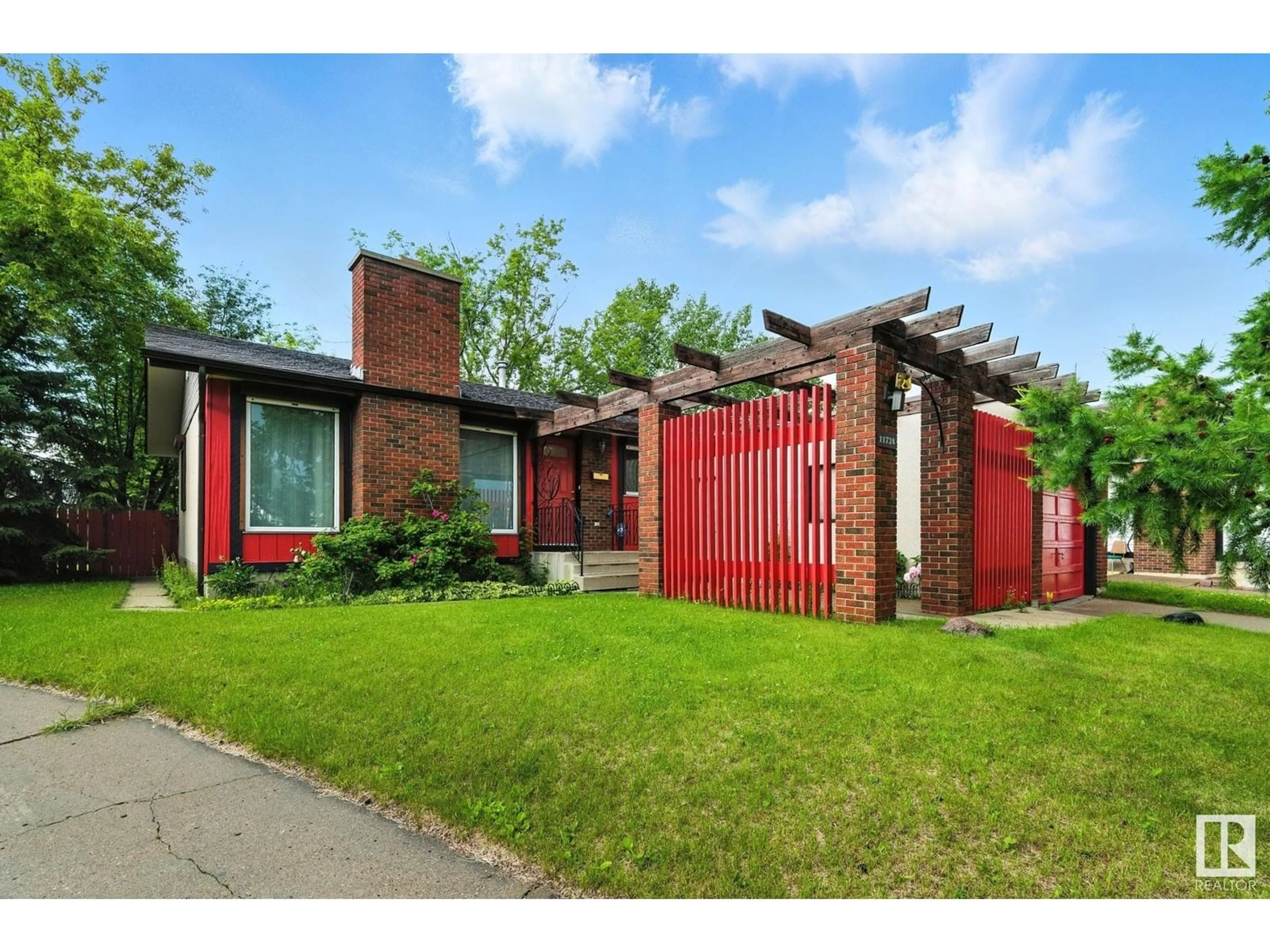 Home with brick exterior material, street for 11724 148 AV, Edmonton Alberta T5X1B6