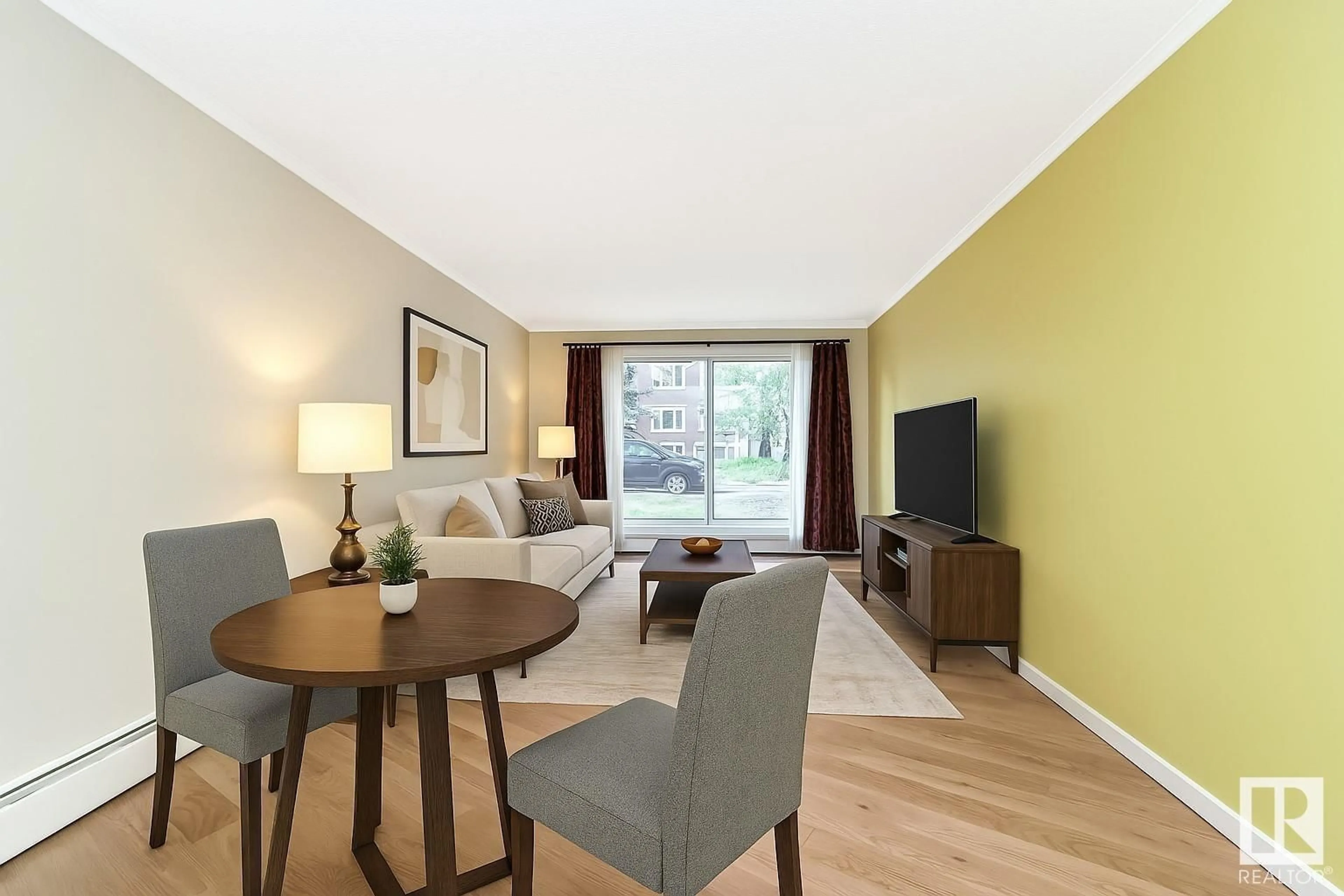 Living room with furniture, wood/laminate floor for 105 - 10547 83 AV, Edmonton Alberta T6E2E1
