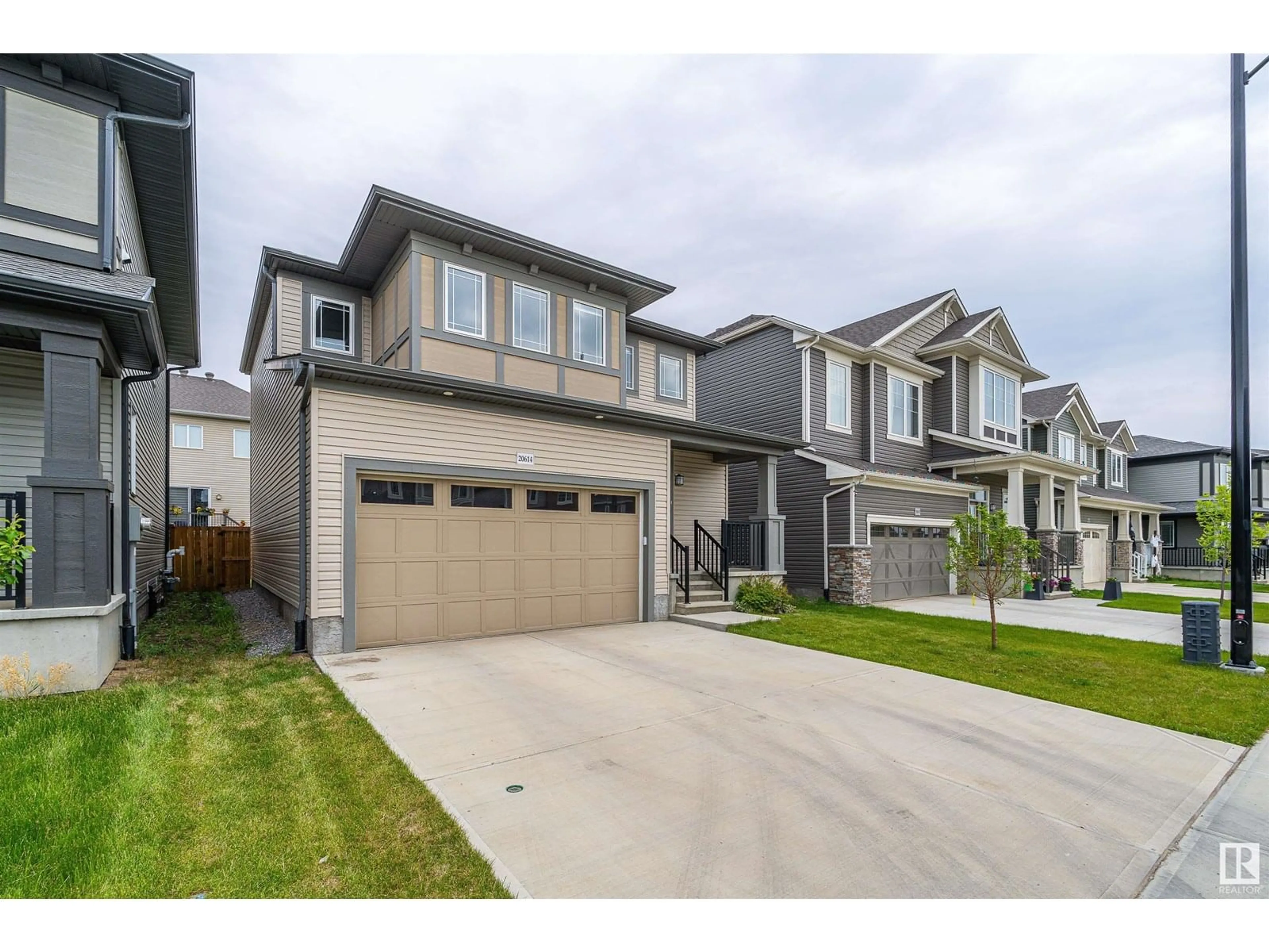 Home with vinyl exterior material, street for 20614 19A AV, Edmonton Alberta T6M1R6