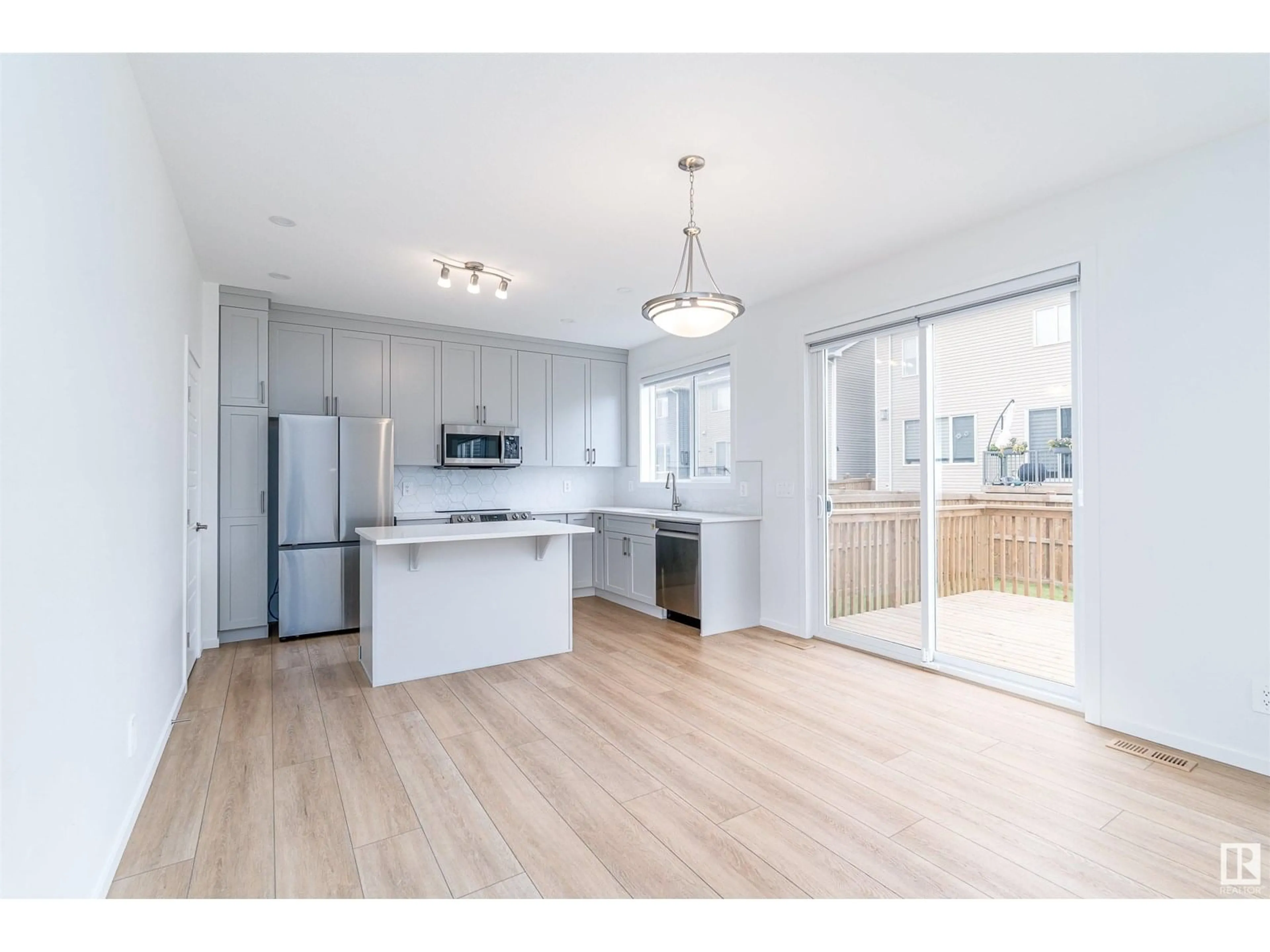 Open concept kitchen, wood/laminate floor for 20614 19A AV, Edmonton Alberta T6M1R6
