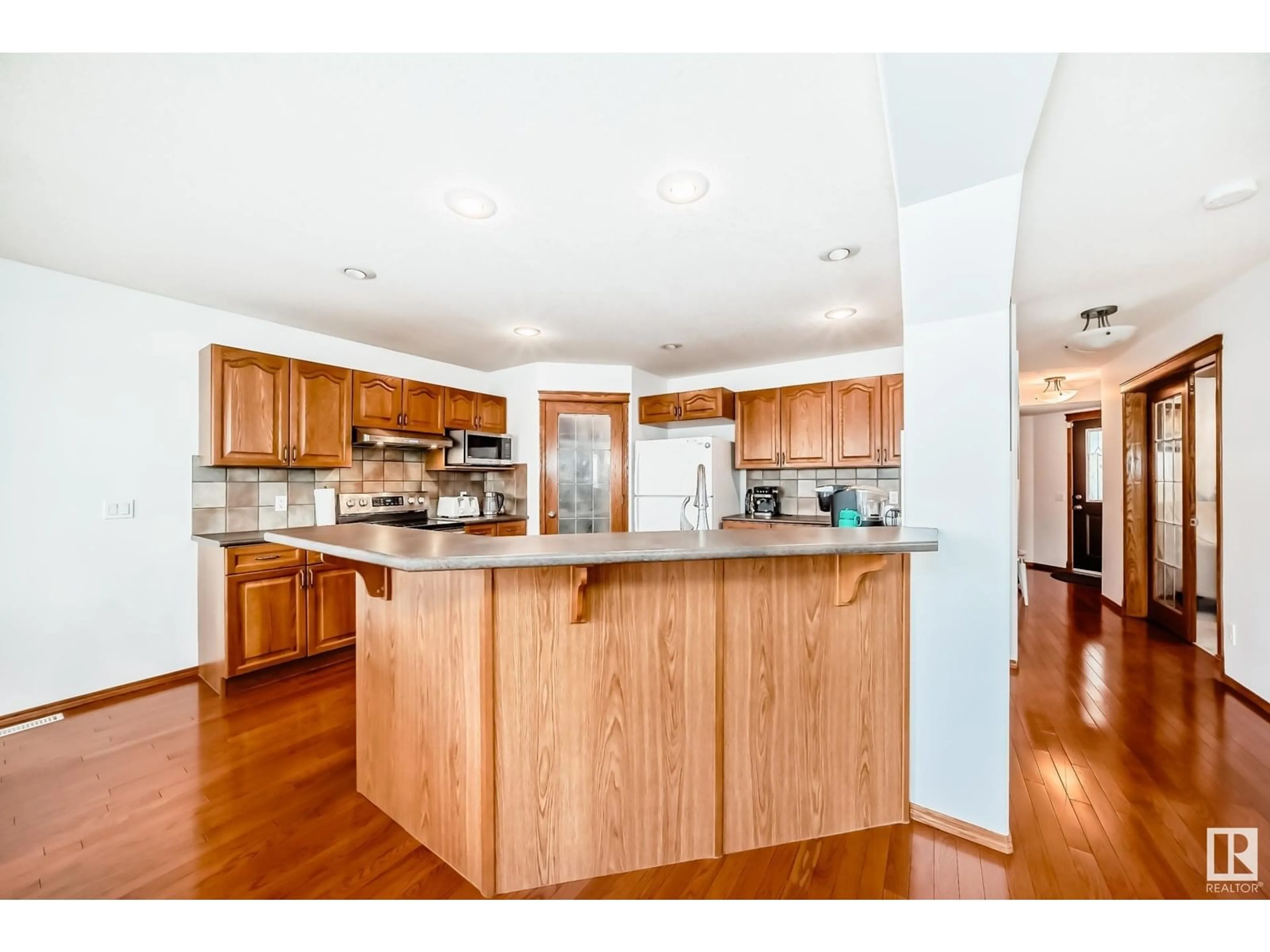 Open concept kitchen, wood/laminate floor for 13416 159 AV, Edmonton Alberta T6V1S4